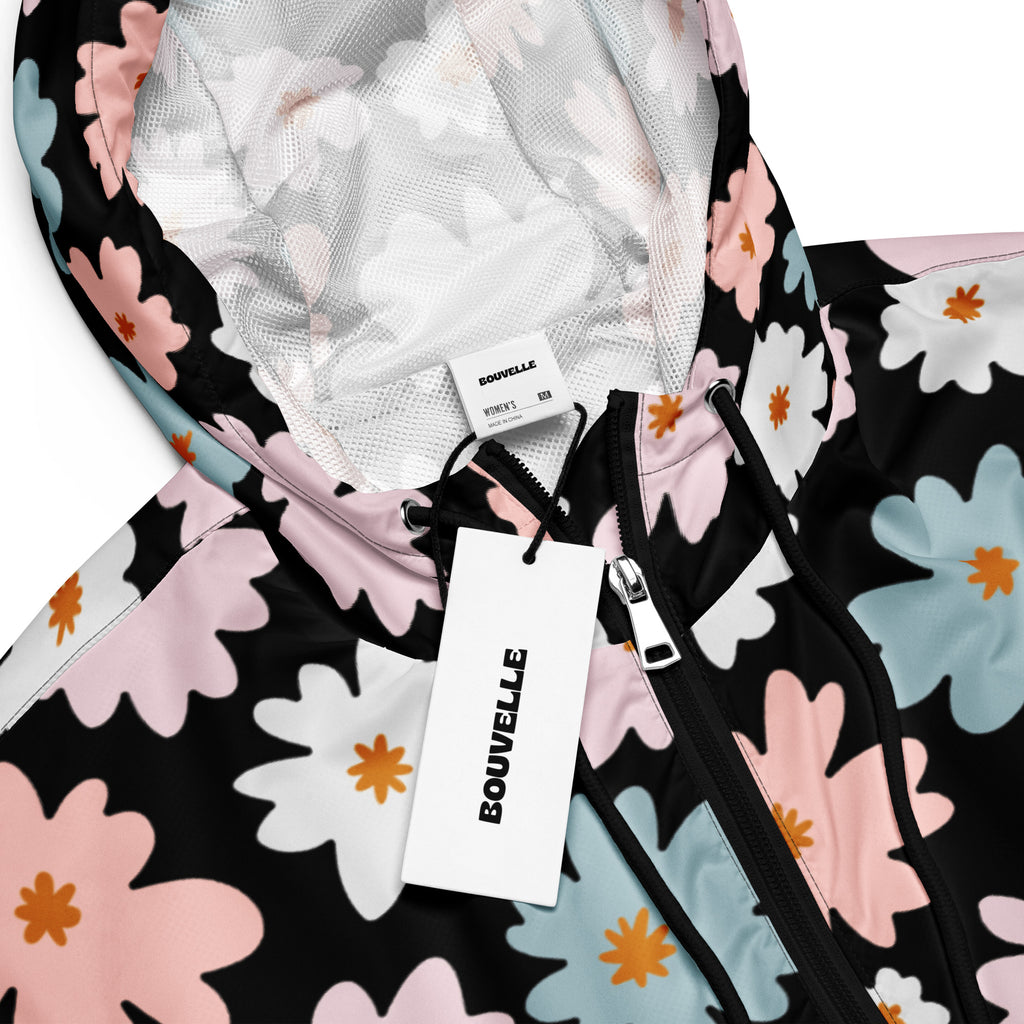 Women’s retro floral cropped windbreaker in black with pink white and light blue flowers with orange centers
