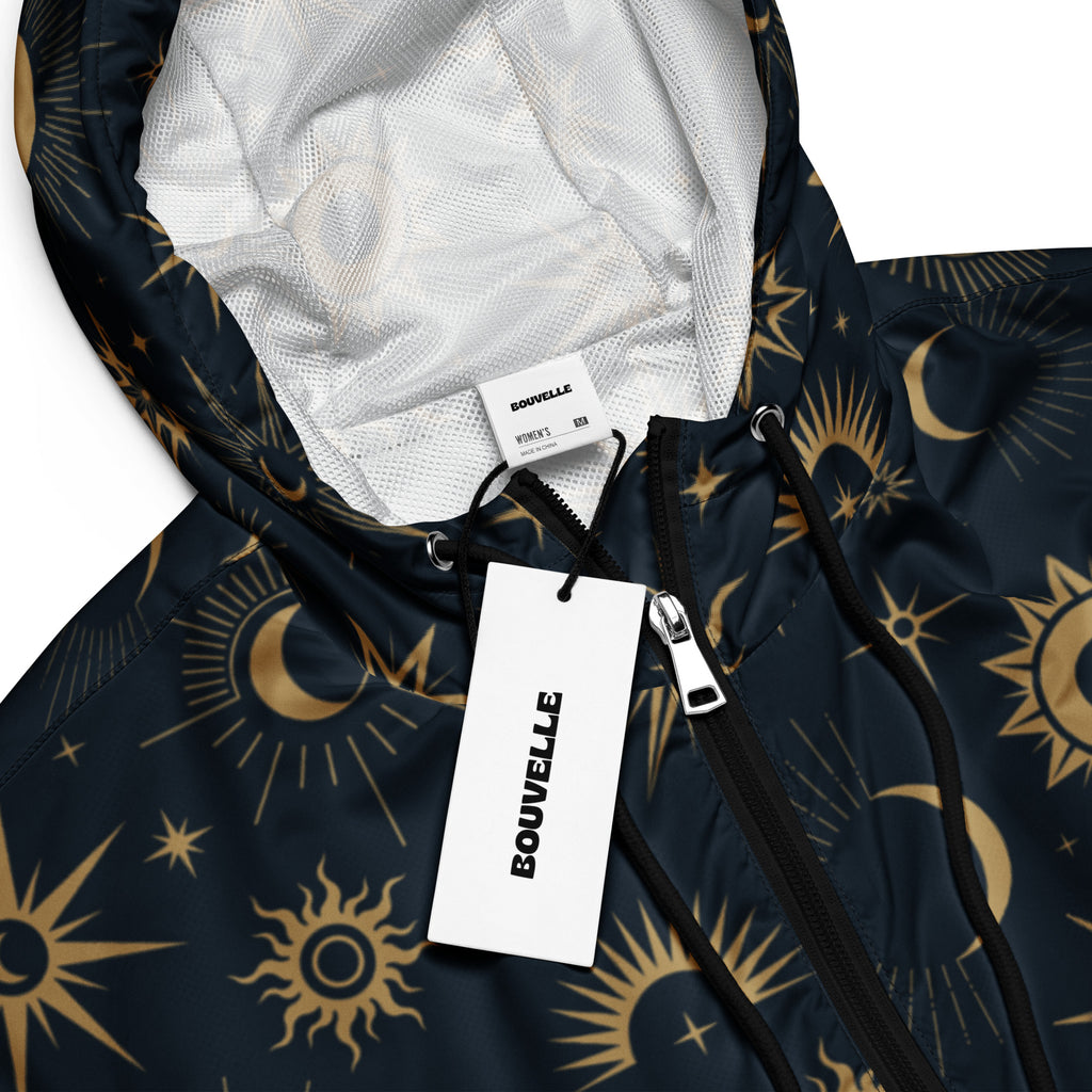 Dark blue women’s cropped hooded windbreaker with gold sun moon star celestial pattern lightweight and water resistant