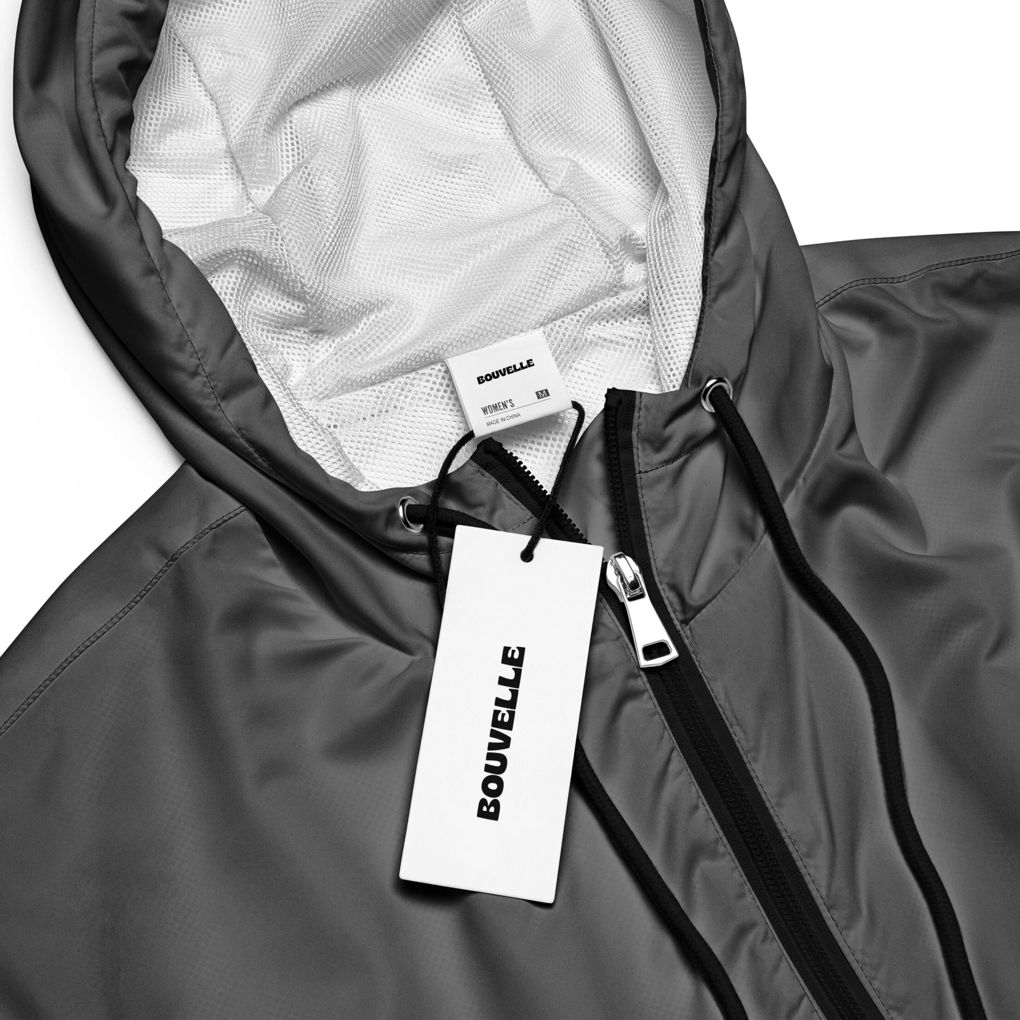 Women’s gray Bouvelle cropped windbreaker with mesh-lined interior, black zipper trim, and adjustable hood and pockets
