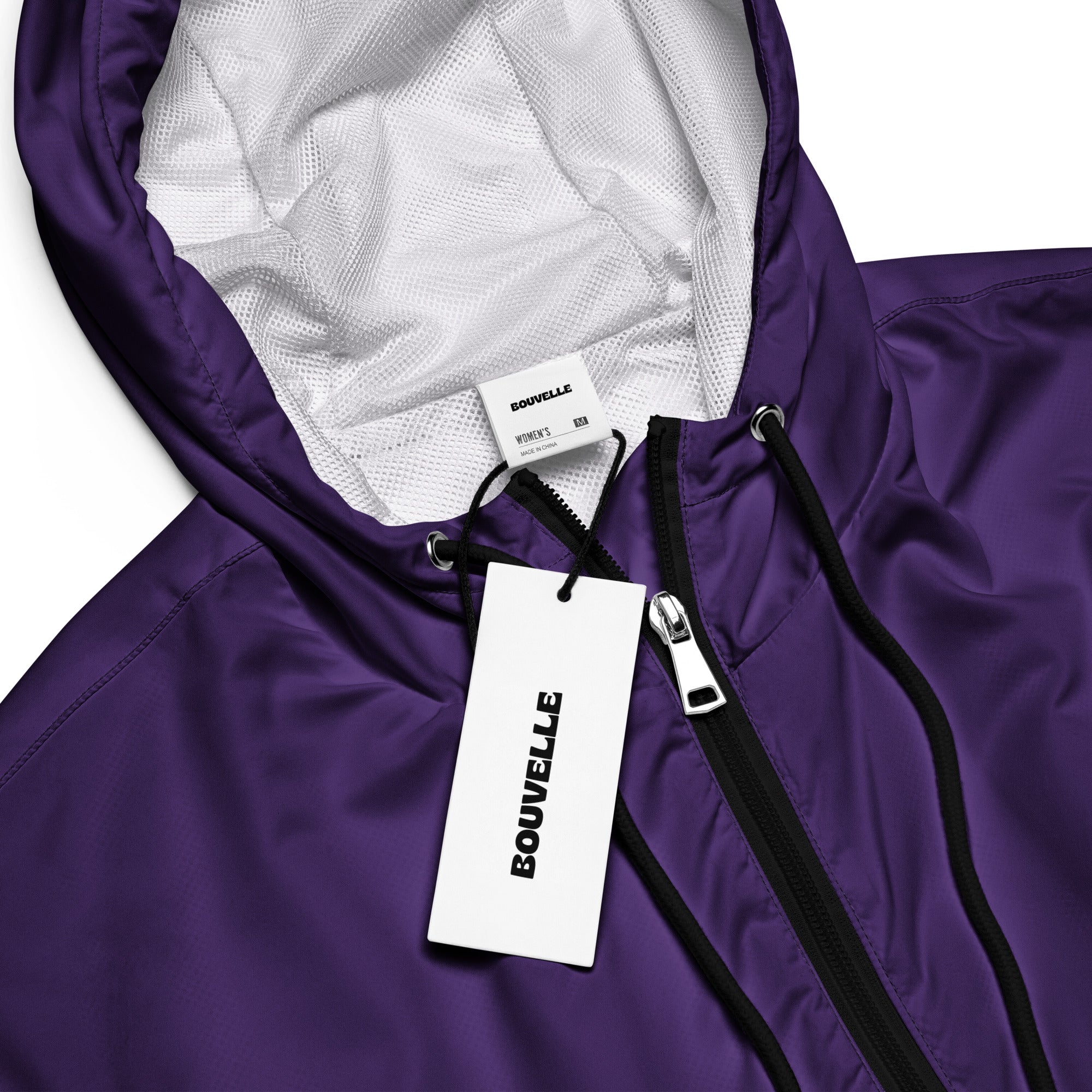 Women’s dark purple cropped windbreaker with adjustable hood white mesh lining and black zipper accents