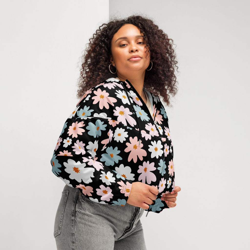 Women’s retro floral cropped windbreaker with vibrant pink white and light blue daisy pattern and adjustable hood