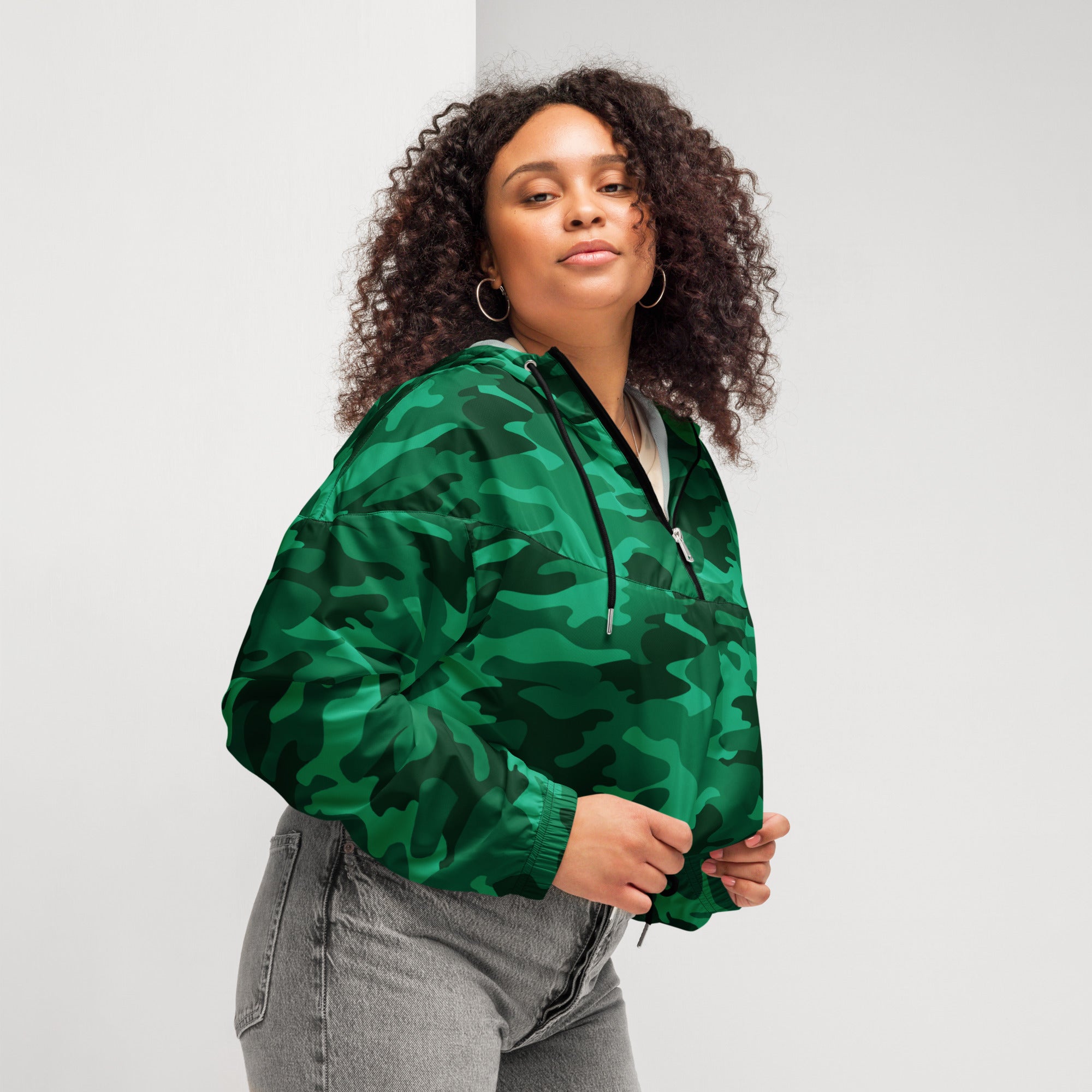 Women’s green camouflage cropped bomber jacket with half-zip front and adjustable drawstring hood