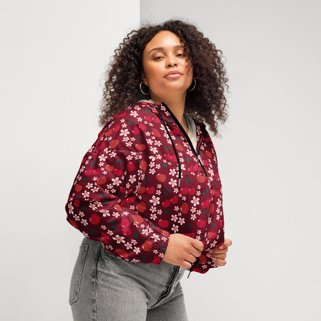 A maroon lightweight women’s cherry blossom cropped windbreaker with cherry and white flower pattern and black zipper accents