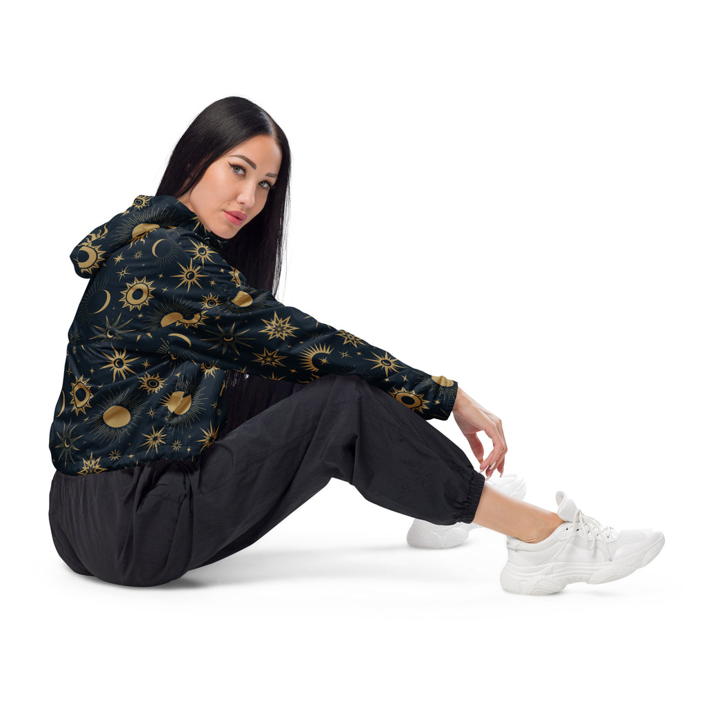 Women’s black hooded cropped windbreaker with gold sun moon and star celestial patterns lightweight and water resistant