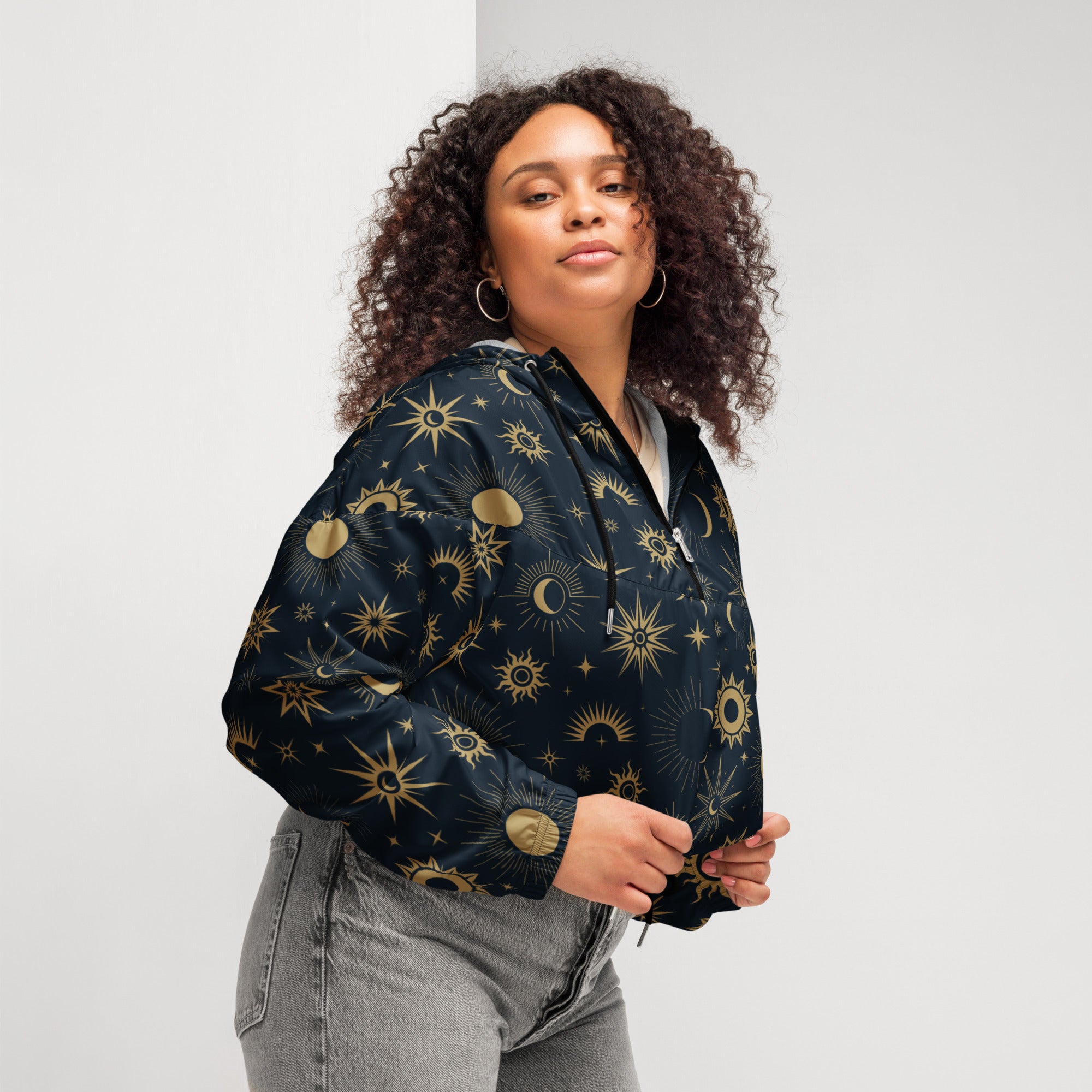 Women’s black bomber jacket with gold celestial sun moon and star patterns lightweight water resistant with hood and pockets