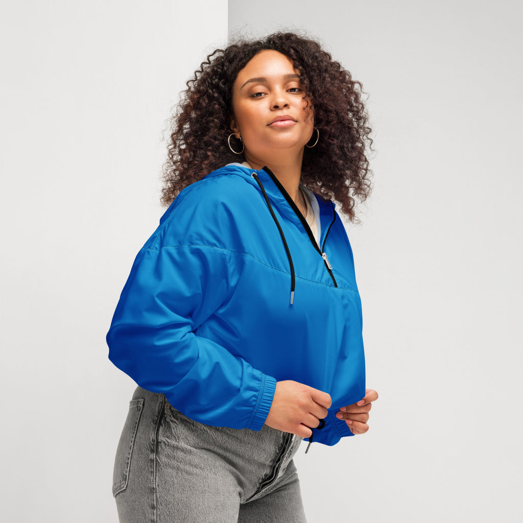 Women’s blue cropped windbreaker made of lightweight nylon with black zipper and adjustable drawstring hood