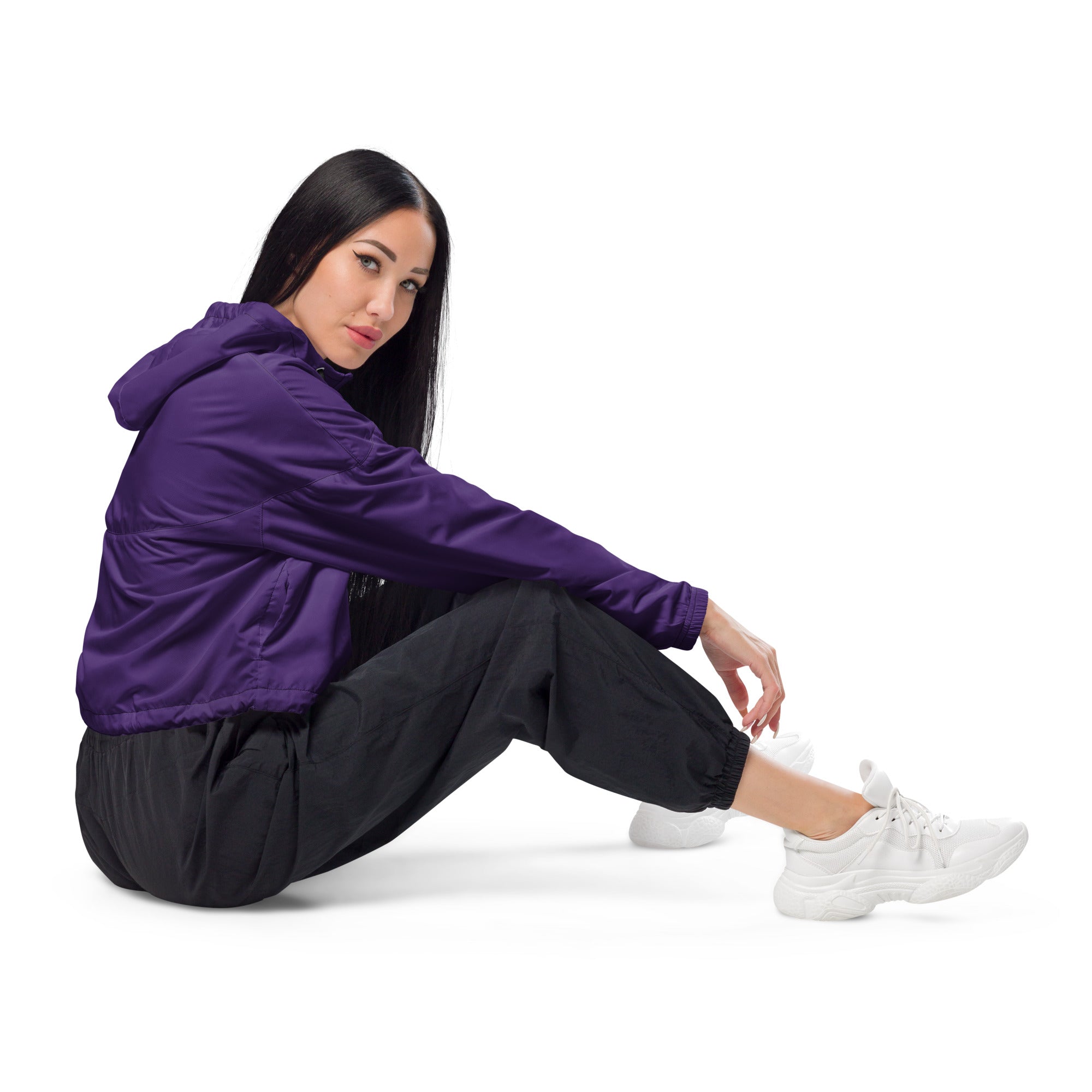 Women’s dark purple cropped windbreaker with lightweight water resistant fabric, adjustable hood, and subtle seam detailing