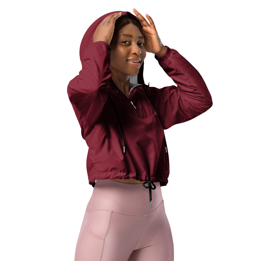 Women’s burgundy cropped windbreaker jacket with shiny nylon finish and black drawstring adjustable hood and pockets