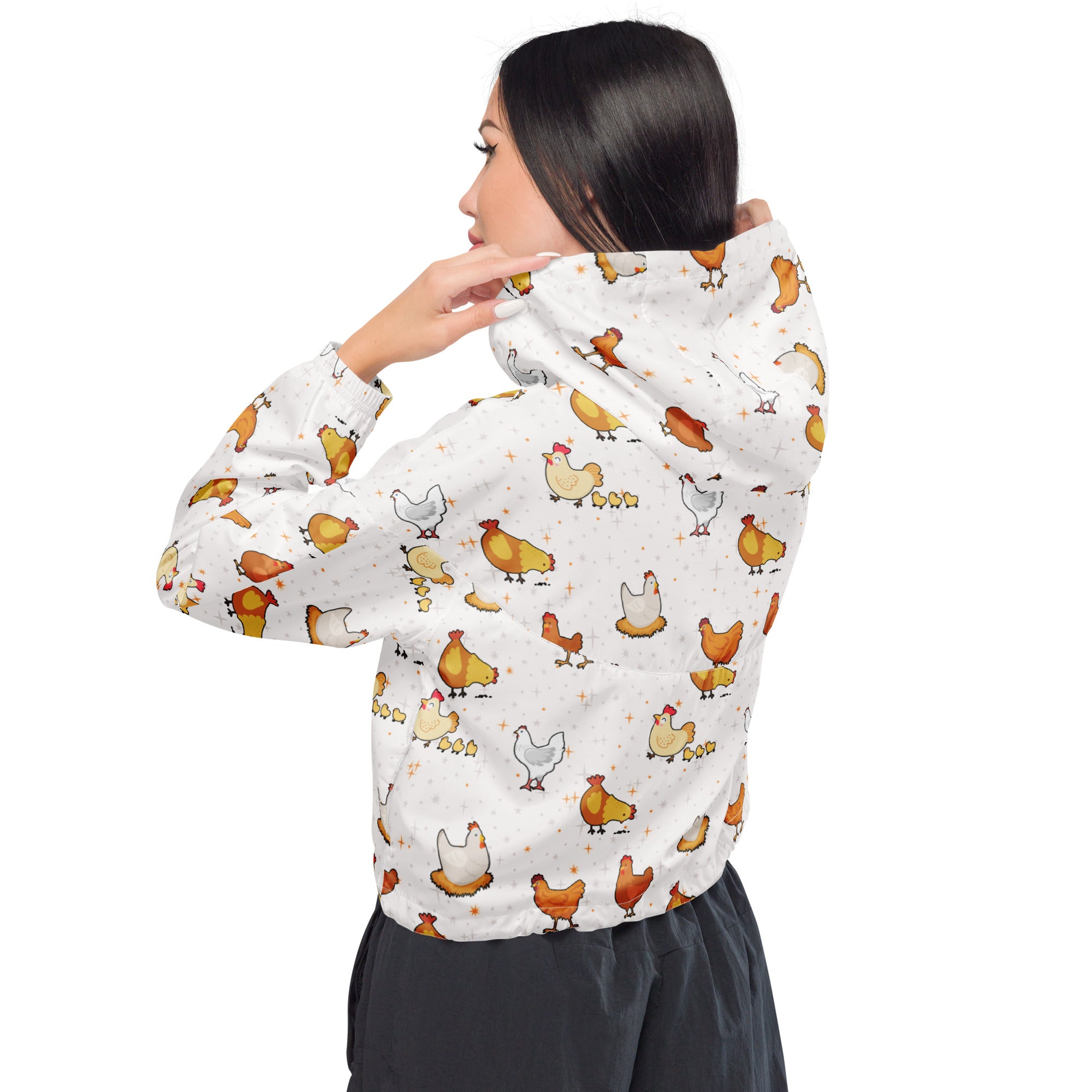Women’s white hooded cropped windbreaker with playful cartoon chicken pattern in yellow brown and white colors