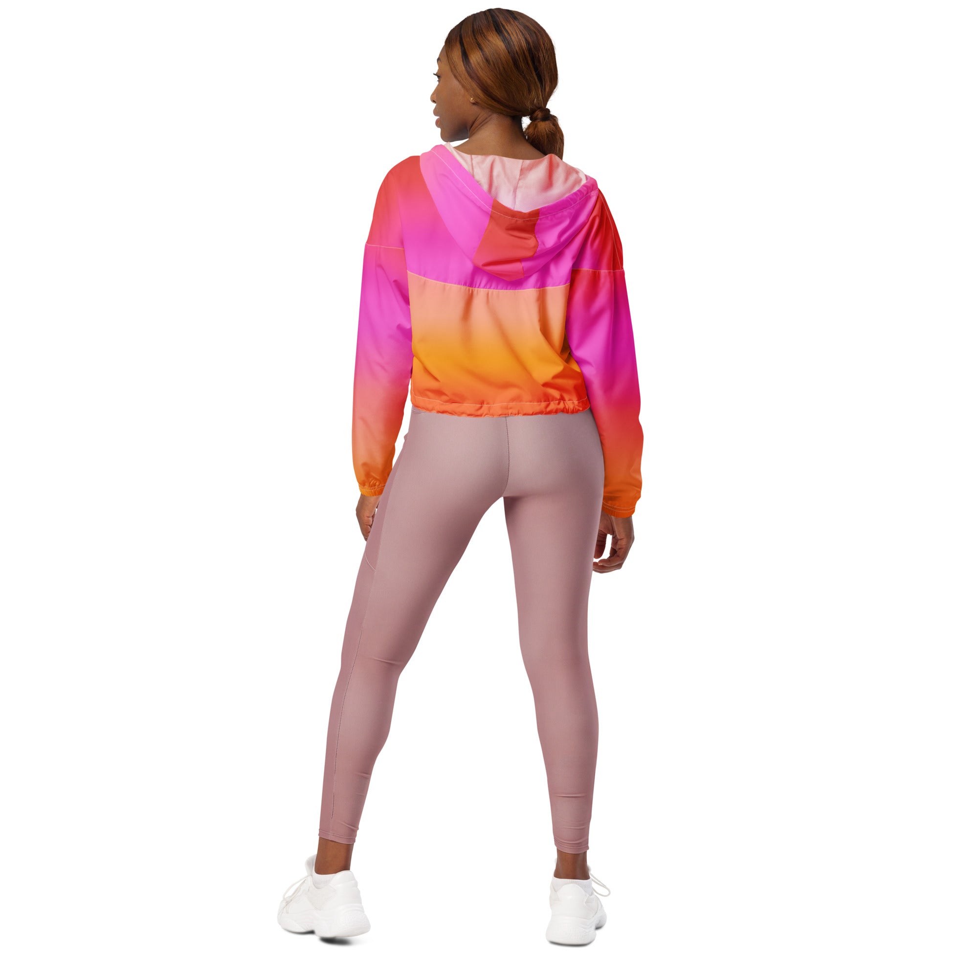 Women’s sunset ombre cropped windbreaker in vibrant pink orange and magenta gradient with adjustable hood and pockets