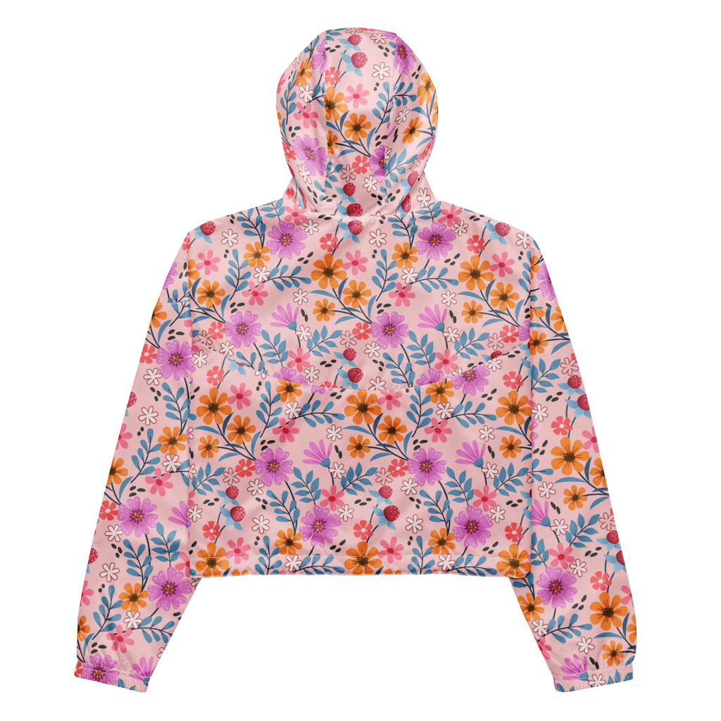 Women’s pink floral cropped windbreaker with adjustable hood and pockets featuring vibrant long-sleeve hoodie design