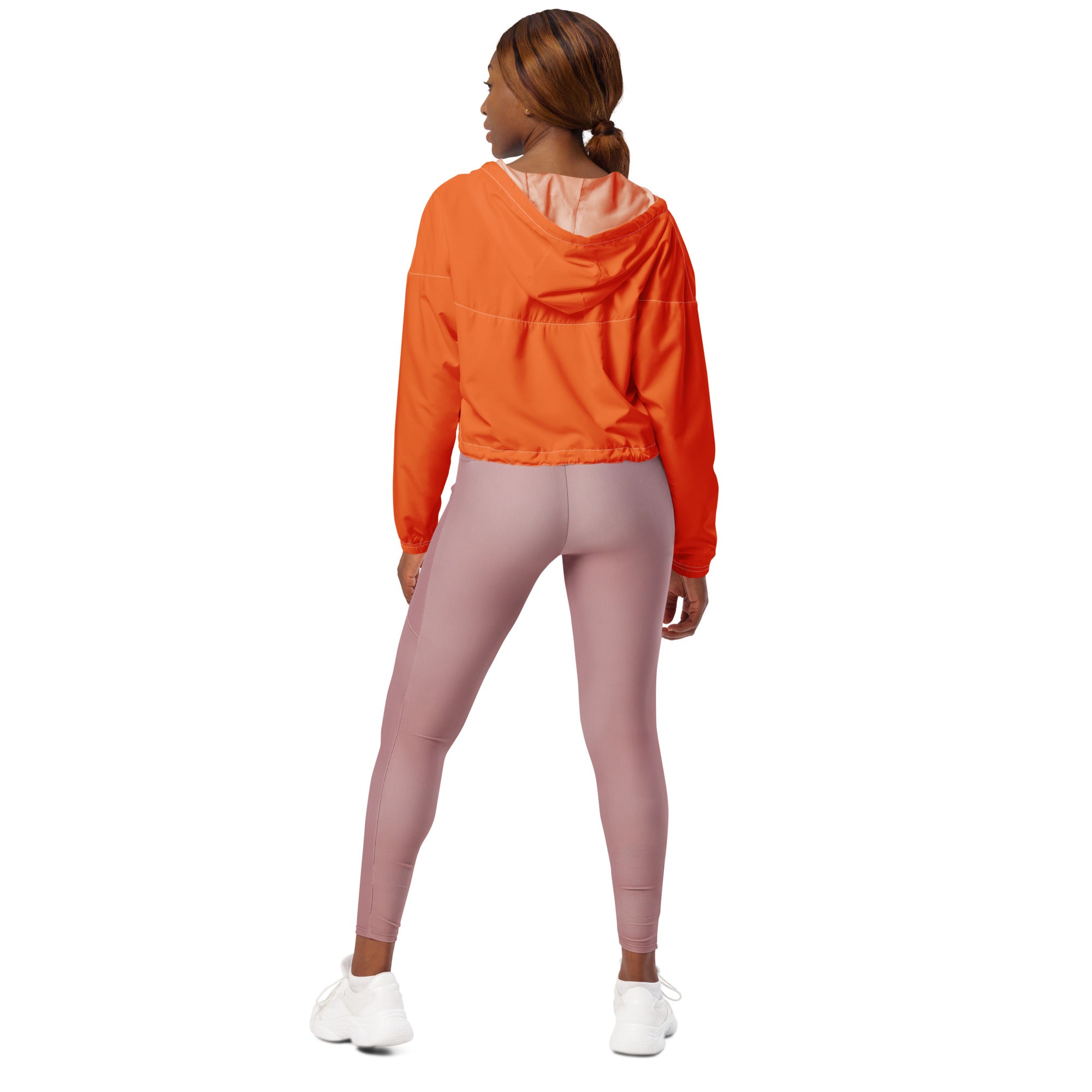 Women’s orange cropped windbreaker with subtle pink lining elastic cuffs lightweight water resistant jacket