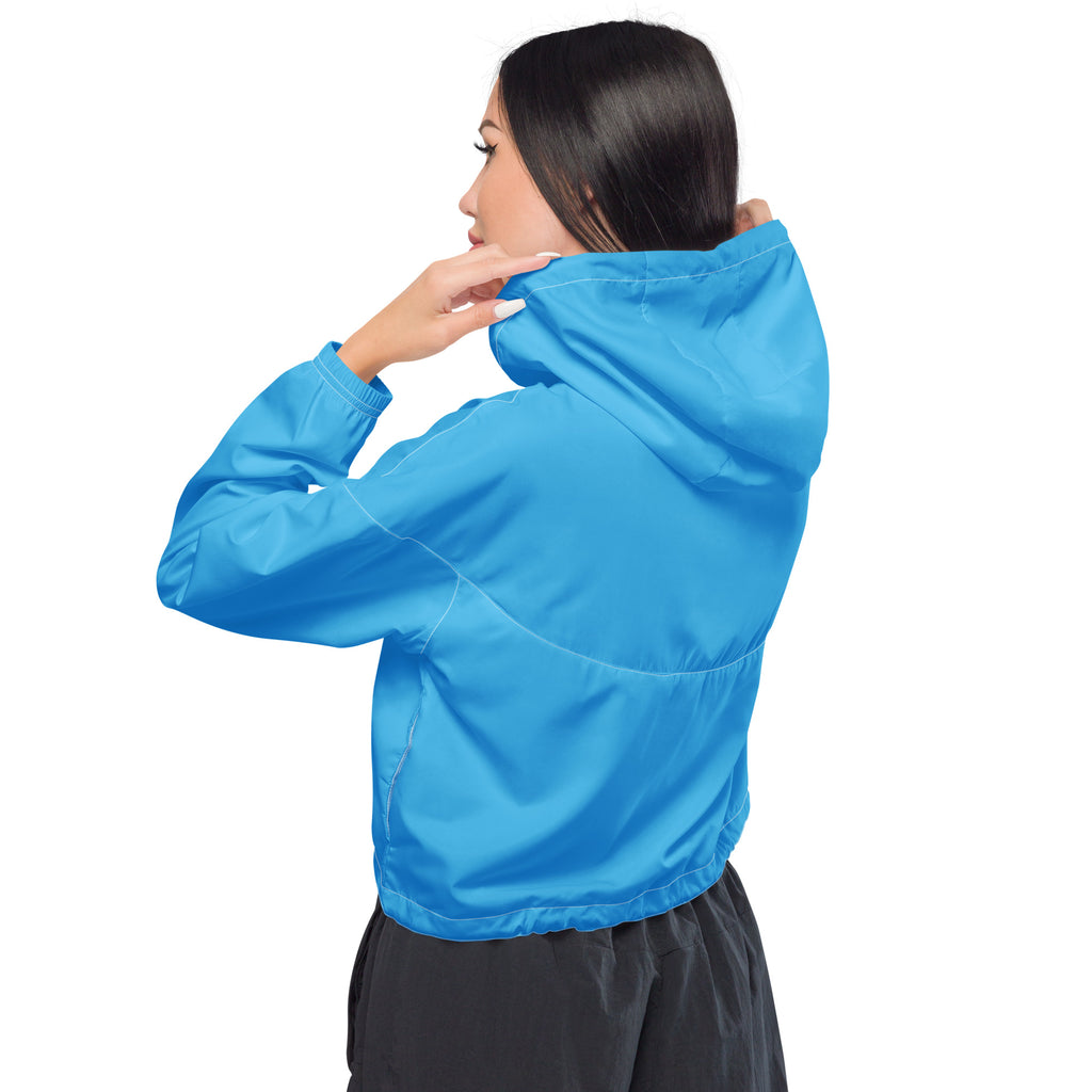 Women’s sky blue cropped windbreaker made of lightweight nylon with elastic cuffs and adjustable hood for wind resistance