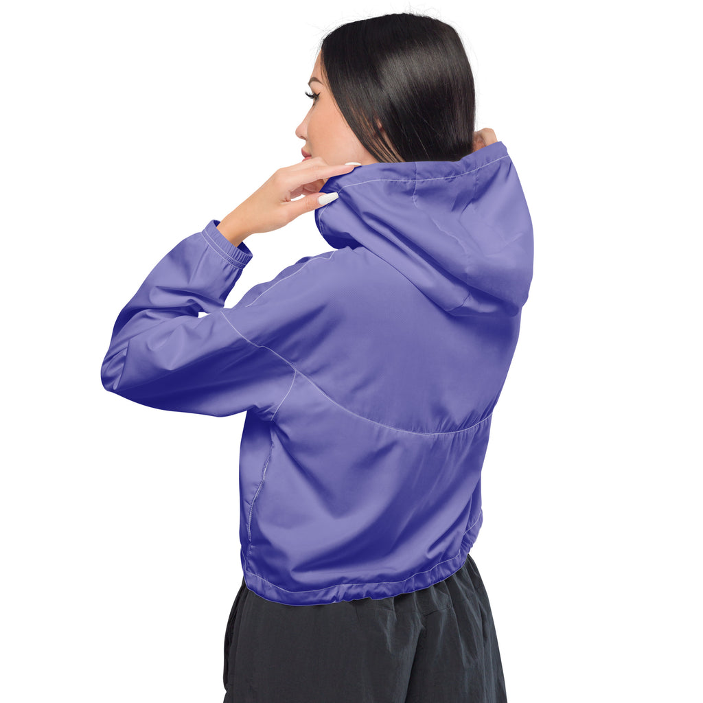 Vibrant purple lightweight women’s cropped windbreaker jacket with adjustable hood and pockets in sleek modern design