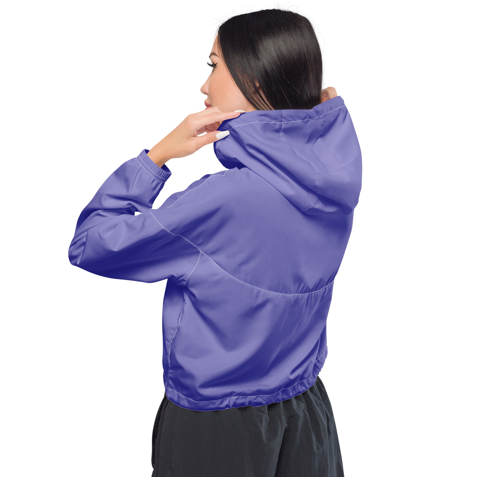 Vibrant purple lightweight women’s cropped windbreaker jacket with adjustable hood and pockets in sleek modern design