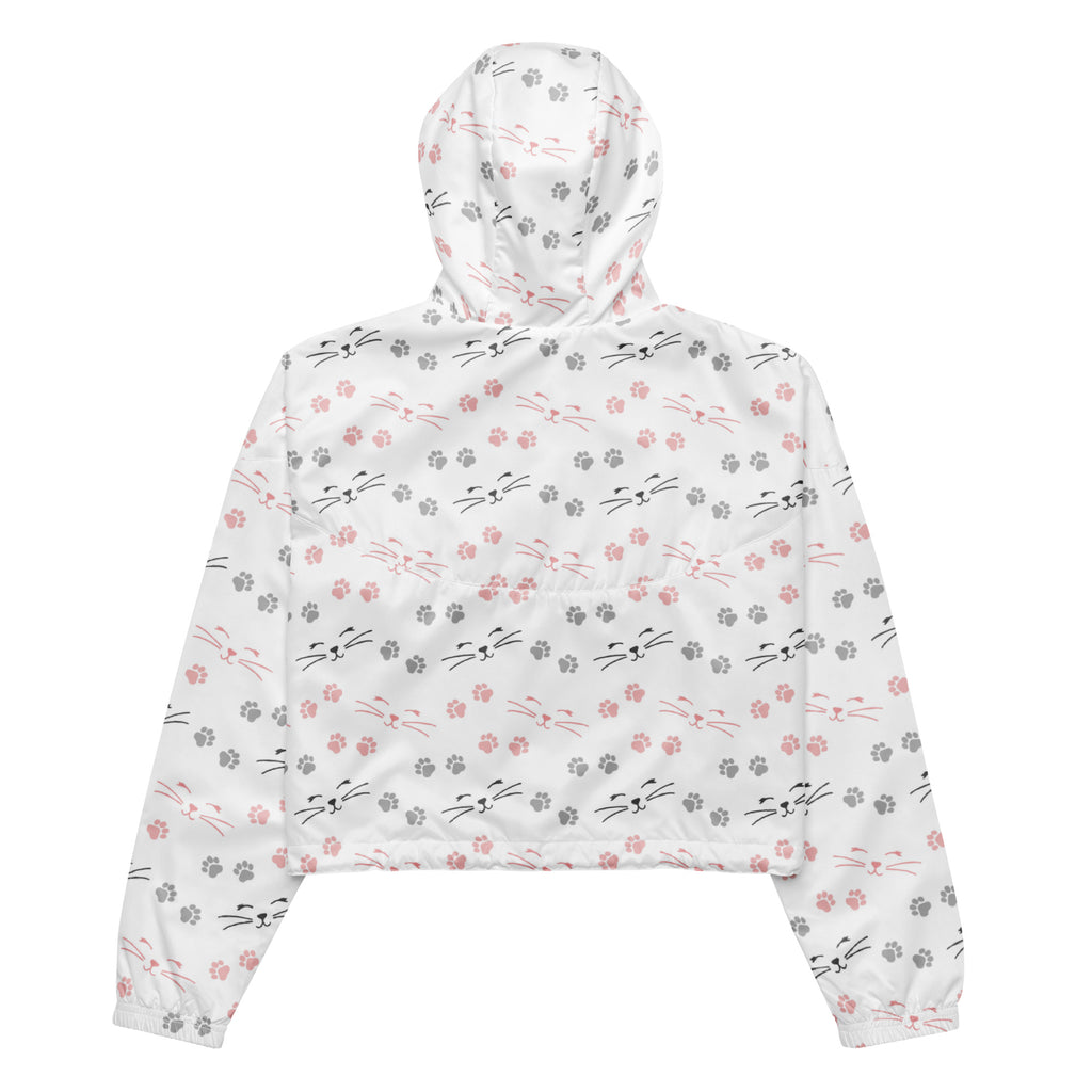 White cropped hoodie with pink and gray cat faces whiskers and paw prints in a playful pattern