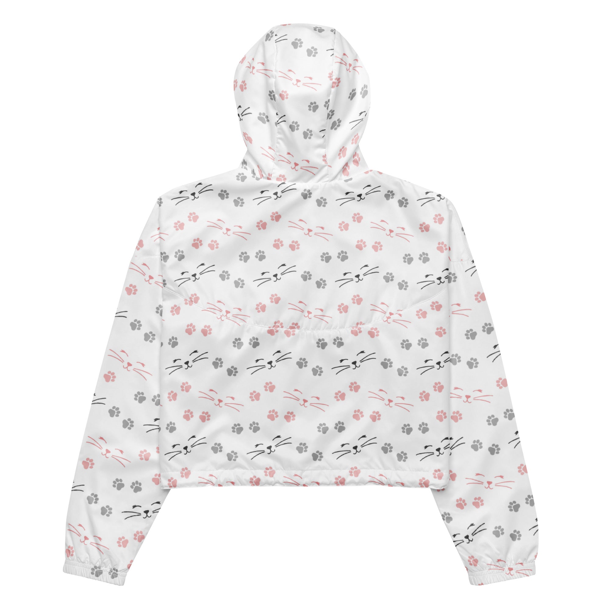 White cropped hoodie with pink and gray cat faces whiskers and paw prints in a playful pattern