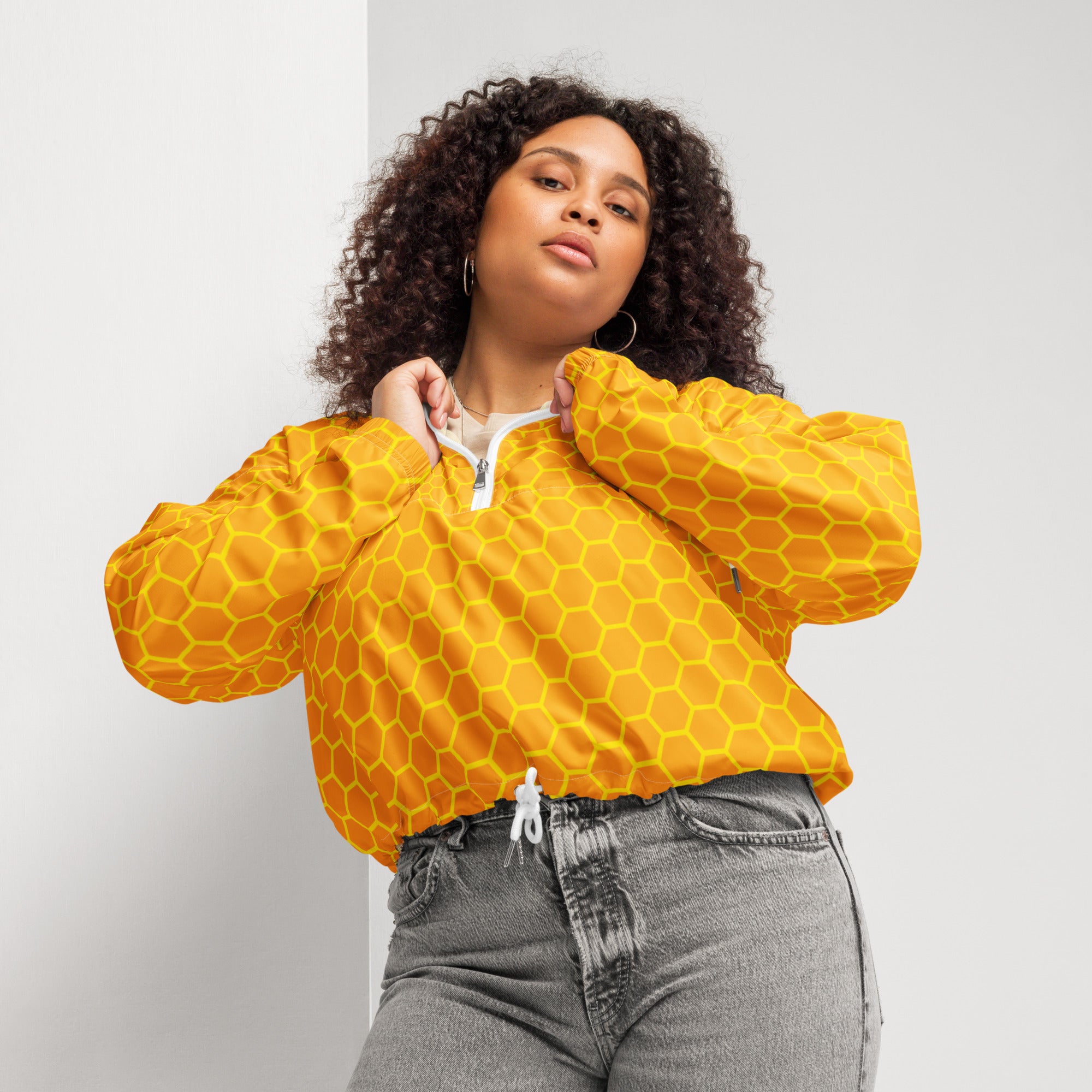 Yellow honeycomb patterned cropped bomber jacket with adjustable hood and pockets lightweight water resistant