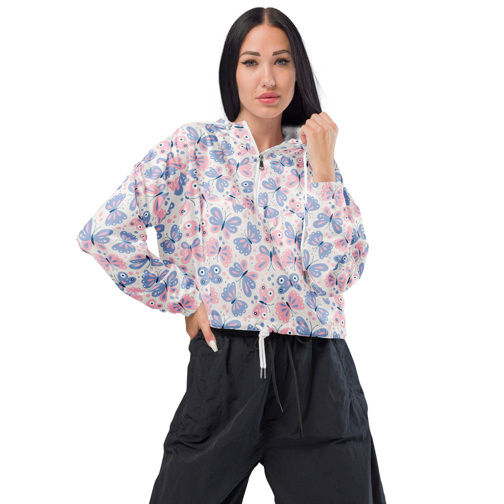 Women’s pastel butterfly cropped windbreaker with pink and blue butterfly pattern on white long sleeves and front zipper