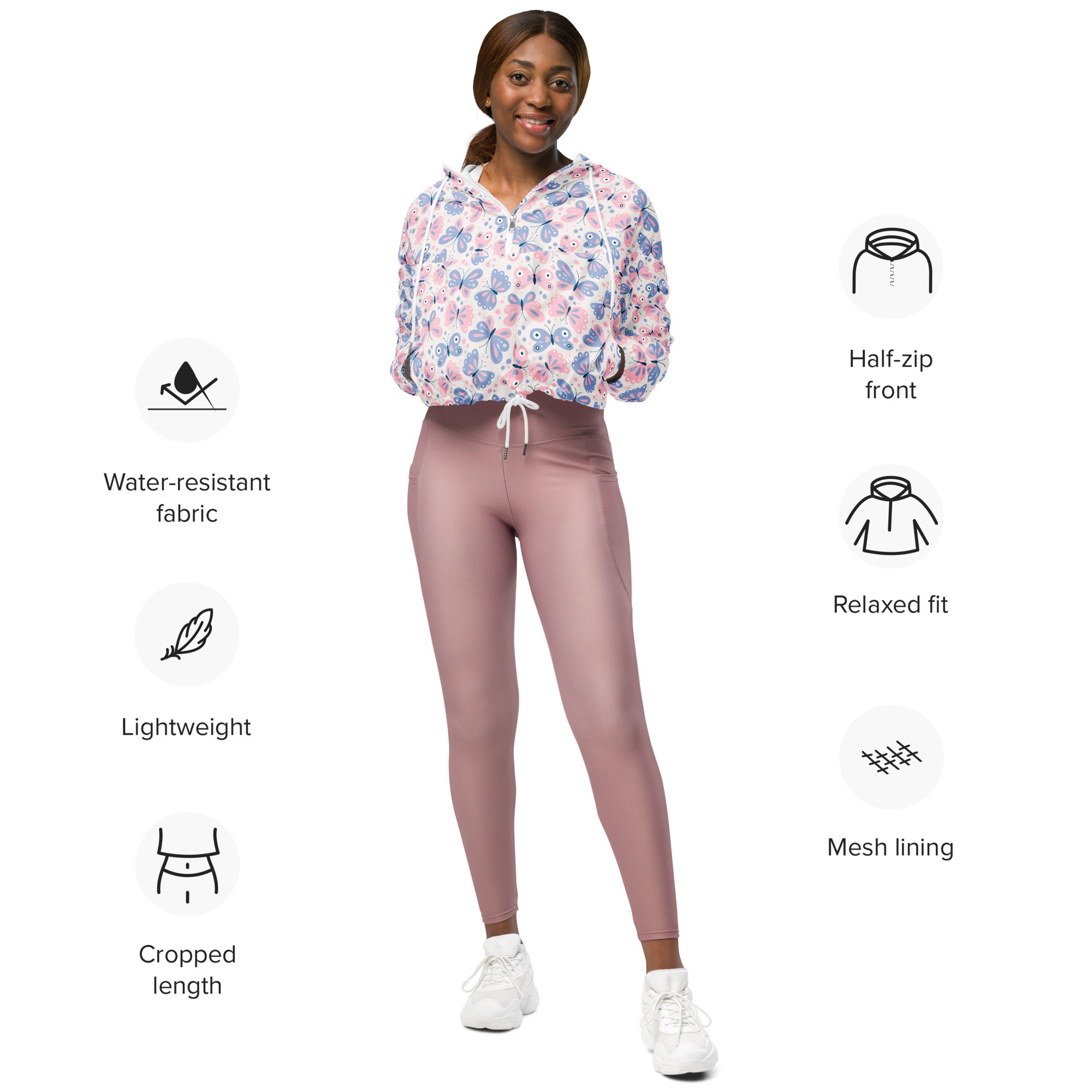 Women’s pastel butterfly cropped windbreaker with floral pattern in soft pink and blue made from water resistant fabric