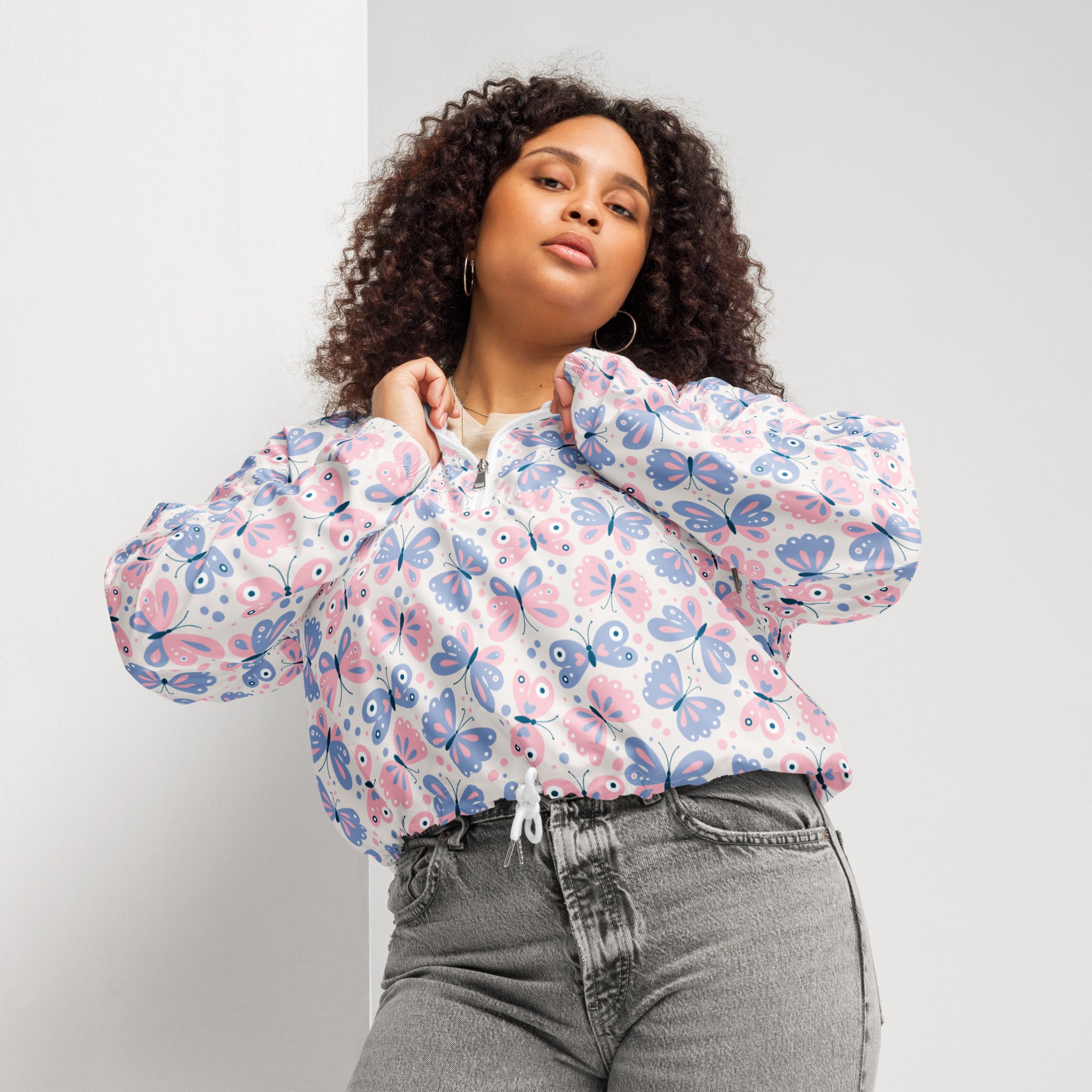 White cropped bomber jacket with pink and blue butterfly pattern lightweight and water resistant with adjustable hood and pockets