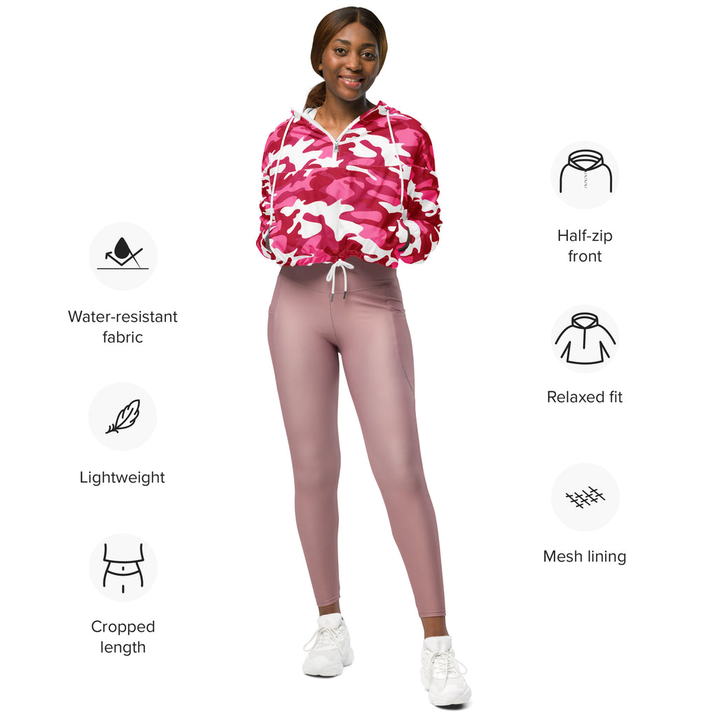 A vibrant pink and white camouflage cropped windbreaker hoodie with half-zip front and water-resistant fabric