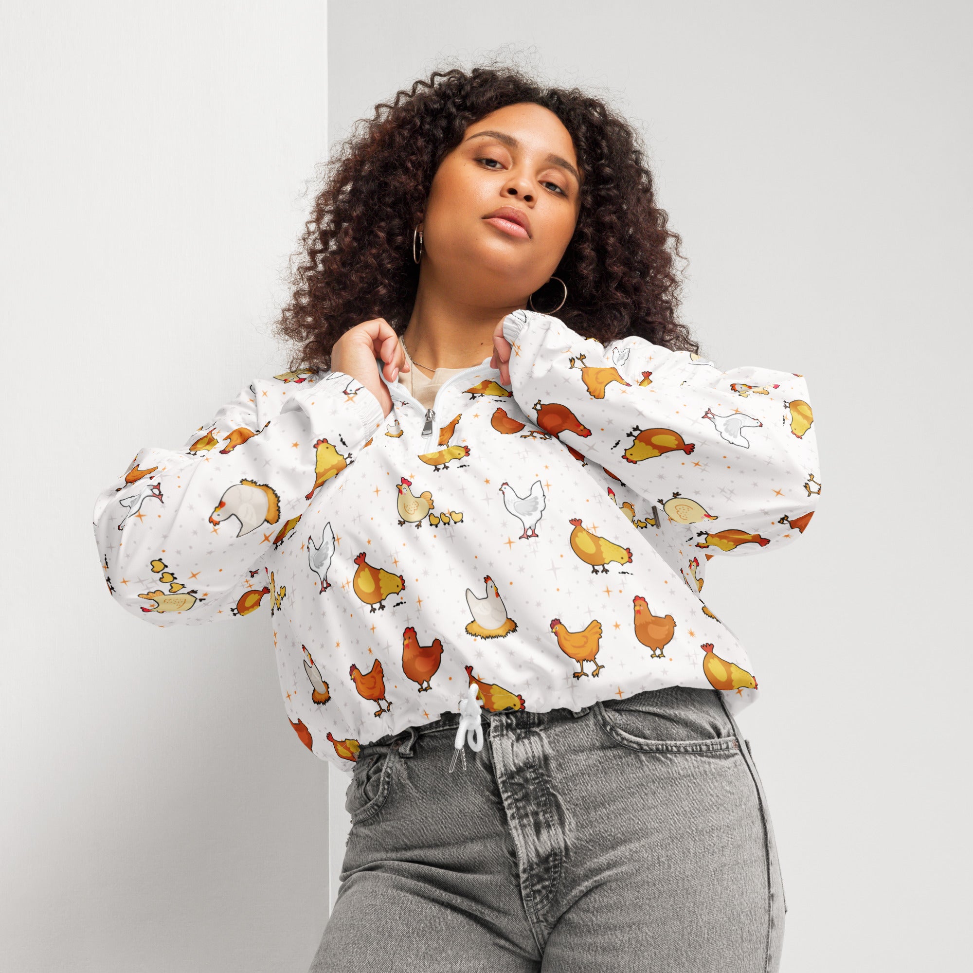 White women’s cropped windbreaker with playful orange brown chicken print lightweight and water resistant with hood and pockets