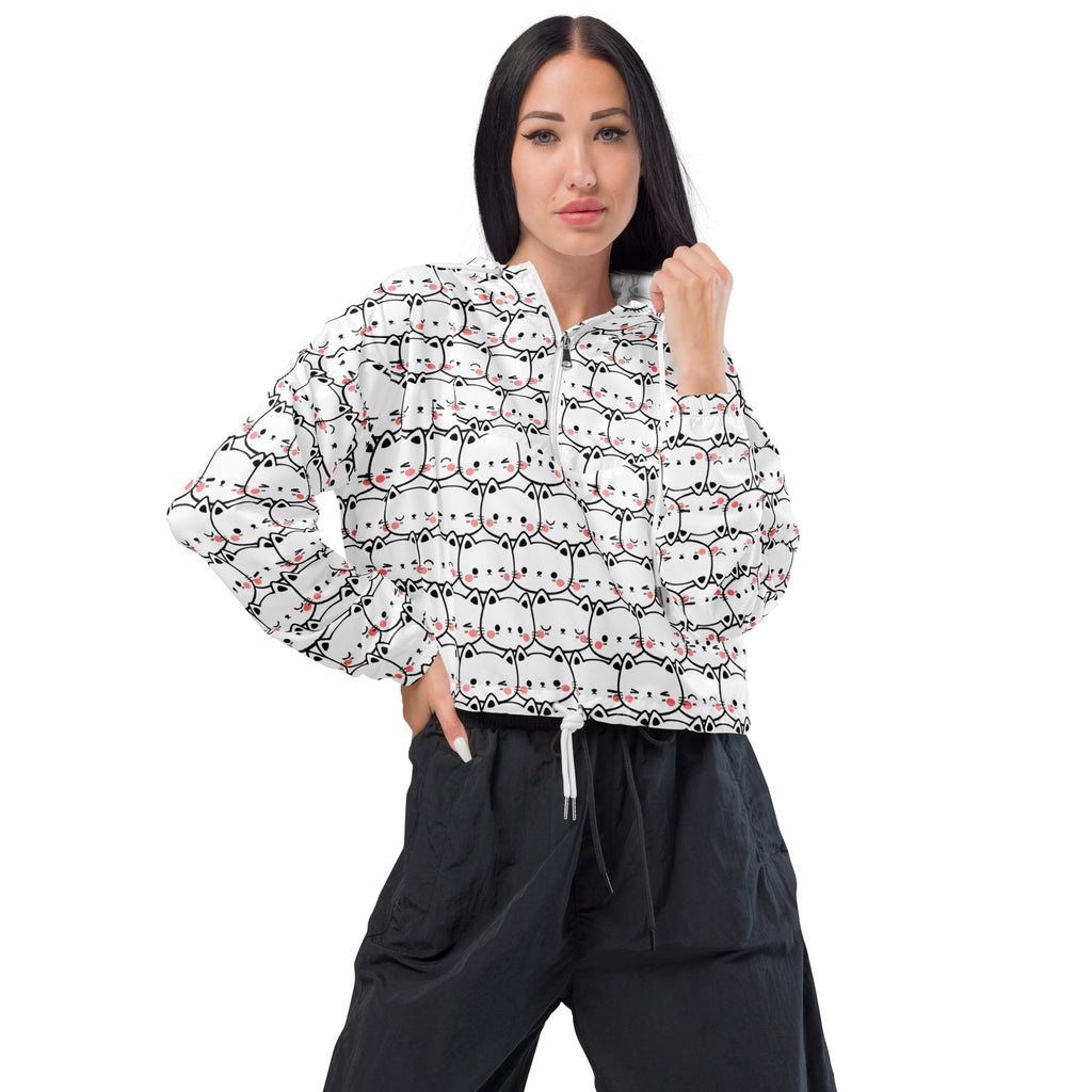 White cropped windbreaker with adjustable hood featuring a repeating black and pink cartoon cat print pattern