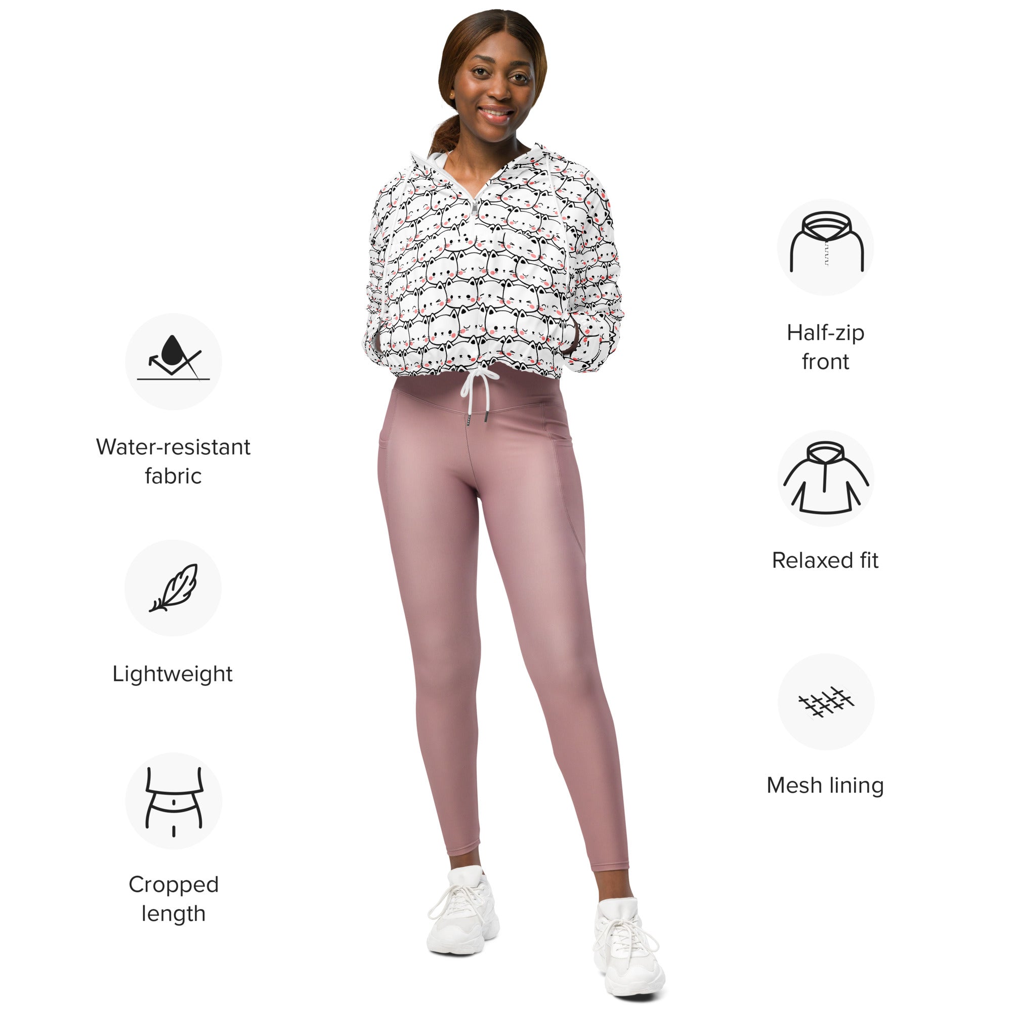 White cropped windbreaker with playful cat print and half-zip front made from lightweight water-resistant fabric