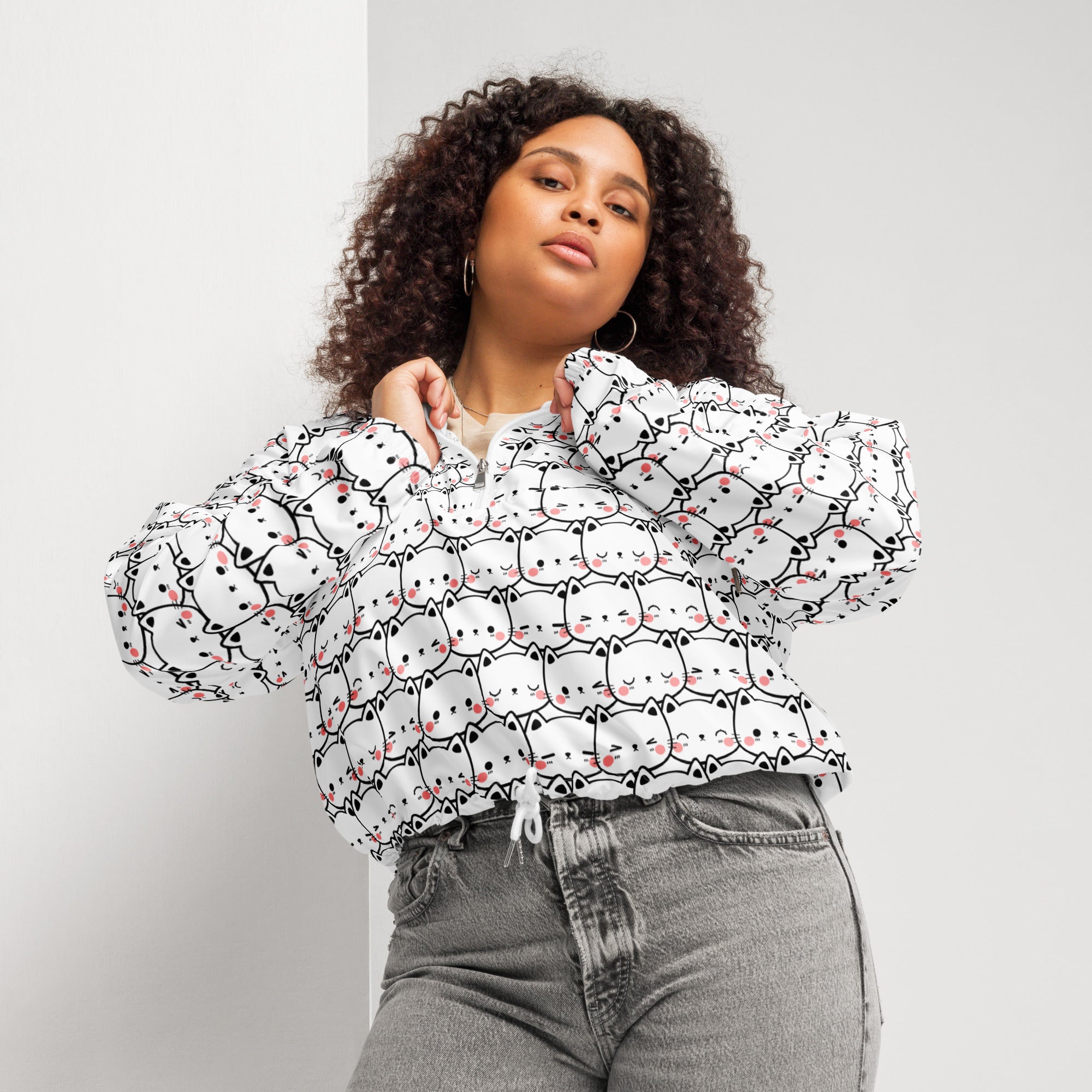 White cropped windbreaker with adjustable hood and pockets featuring black and pink cartoon cat print for women