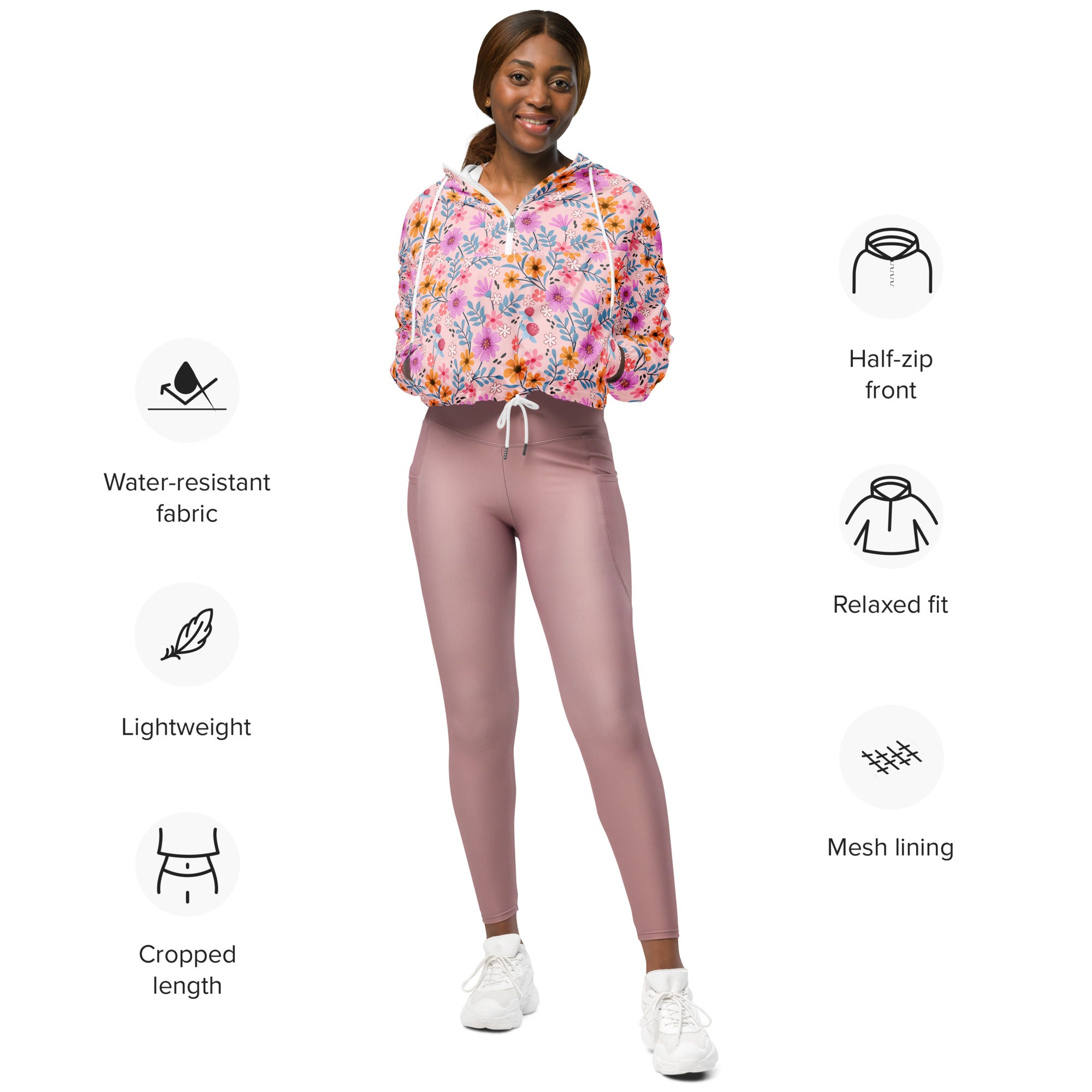 Women’s pink floral cropped windbreaker with half-zip front mesh lining adjustable hood and pockets
