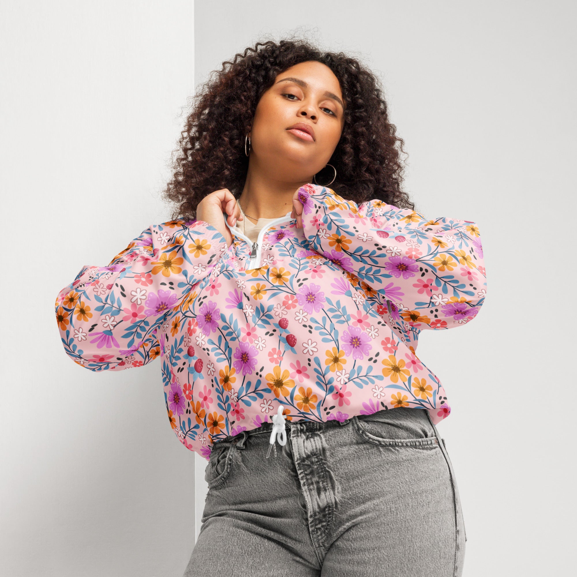 Women’s pink floral cropped windbreaker jacket with long sleeves white zipper closure lightweight and water resistant