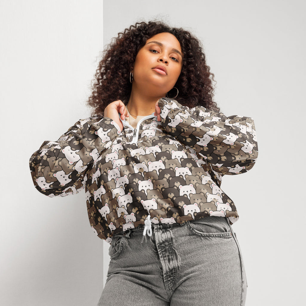 A plus-size woman wears a lightweight water resistant women’s bear face cropped windbreaker with adjustable hood and pockets