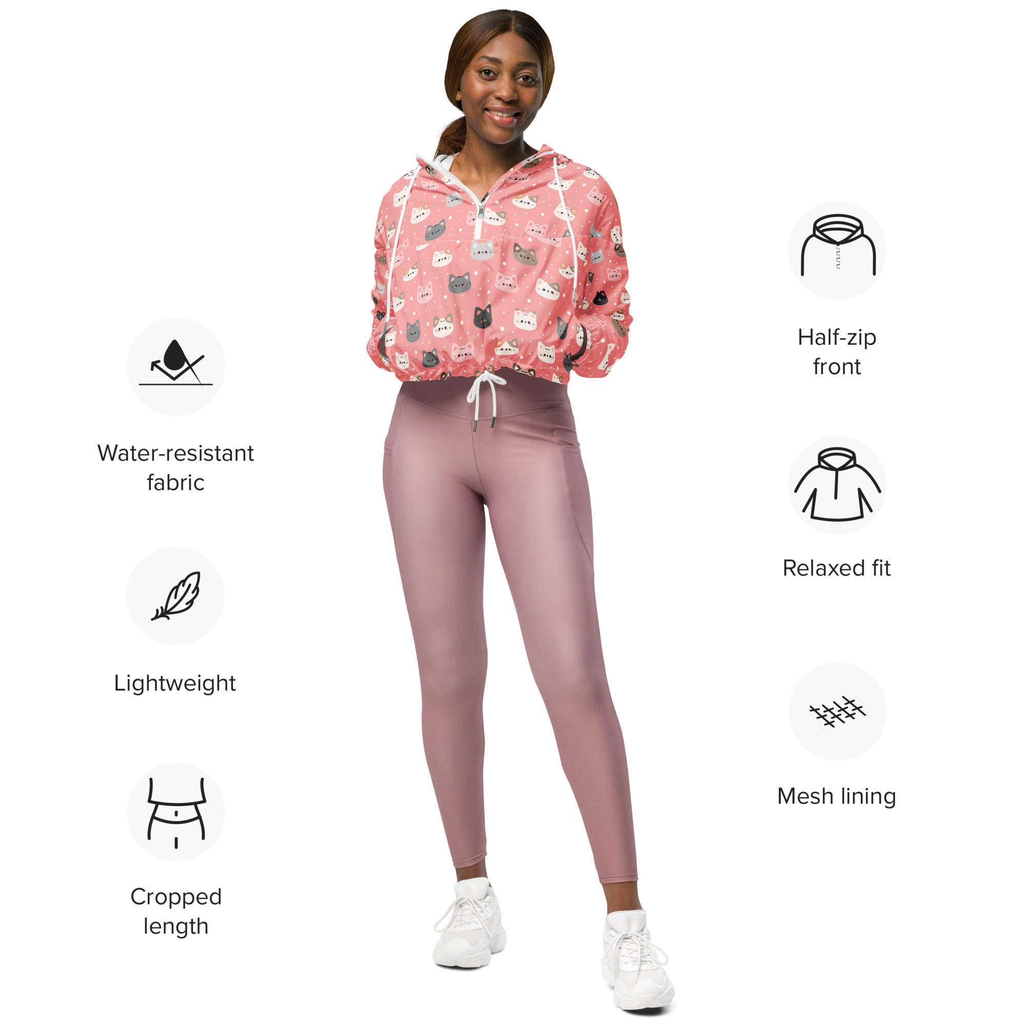 Women’s cute pink cropped windbreaker with playful cat faces print and white drawstring hood lightweight and water resistant