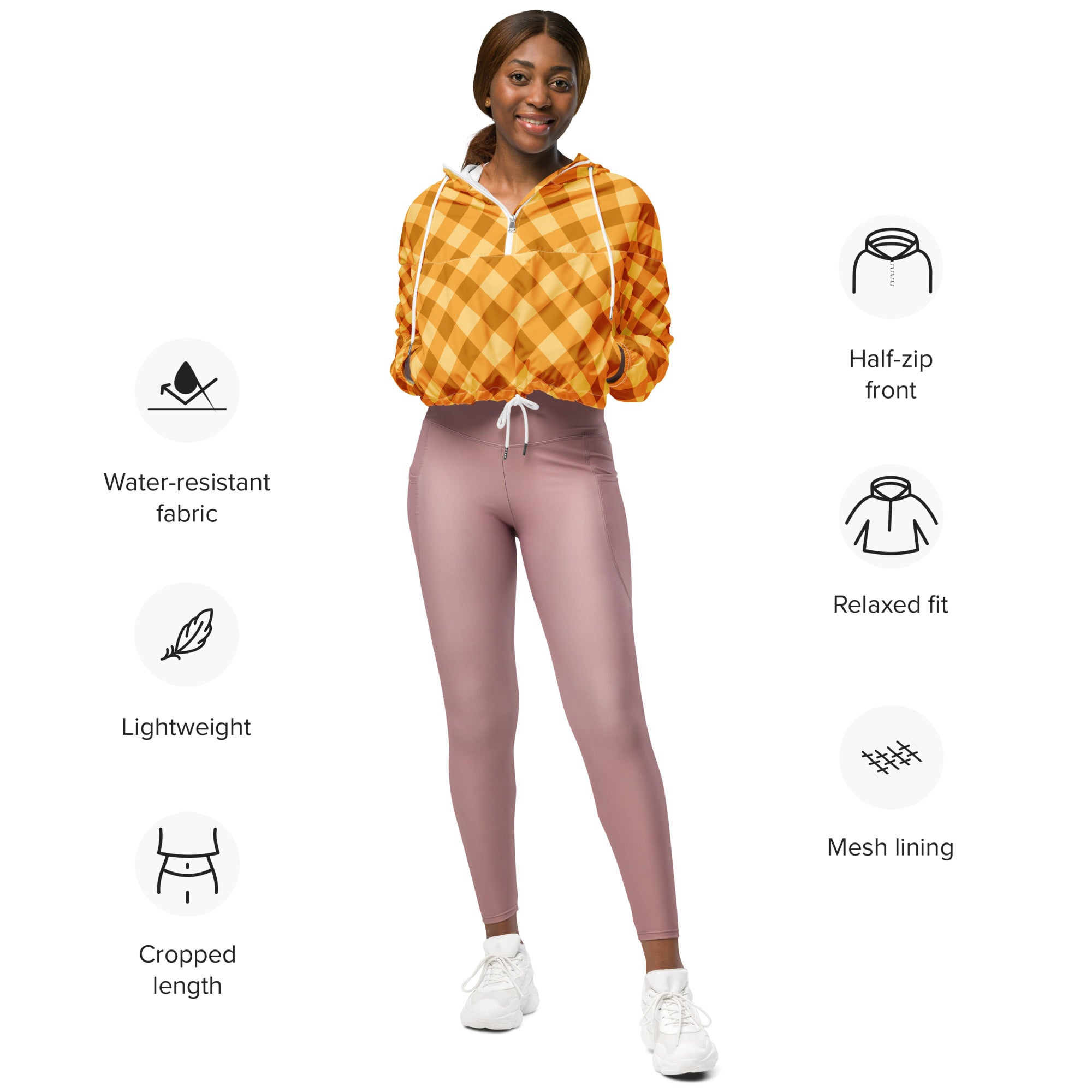 Women’s orange gingham cropped windbreaker with half-zip front made from lightweight water resistant fabric