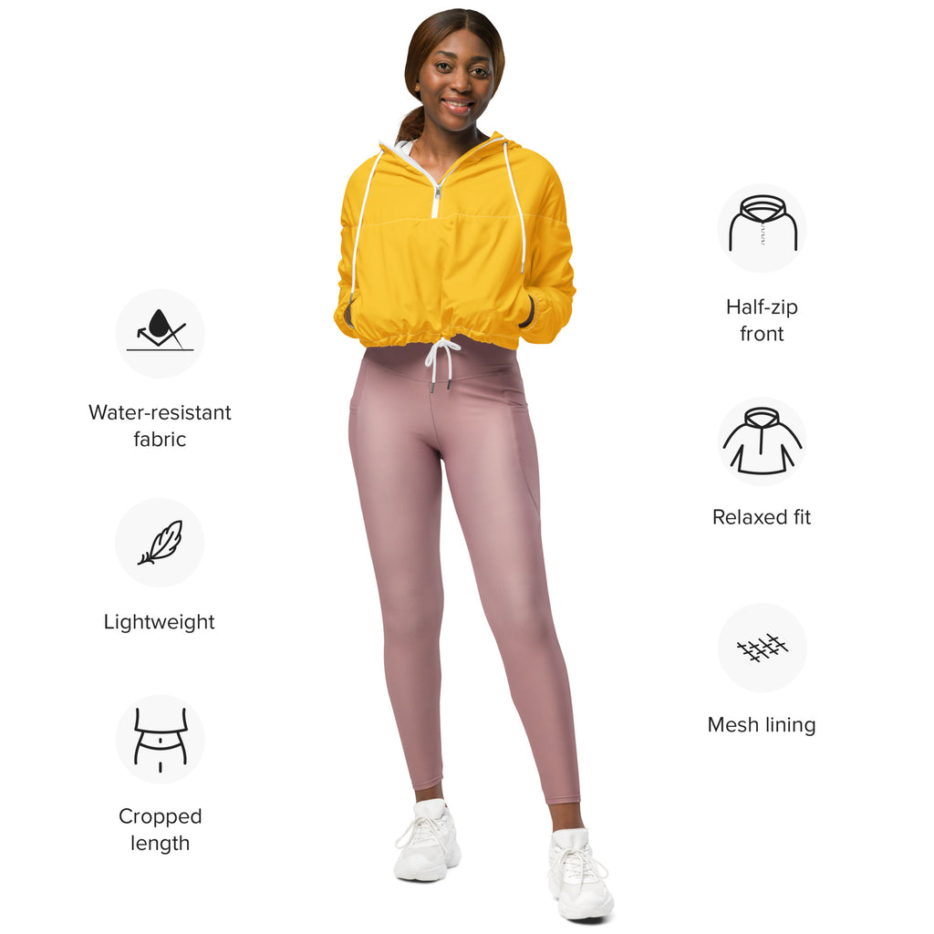 Women’s yellow cropped windbreaker with half-zip front white drawstrings lightweight water resistant jacket paired with mauve leggings