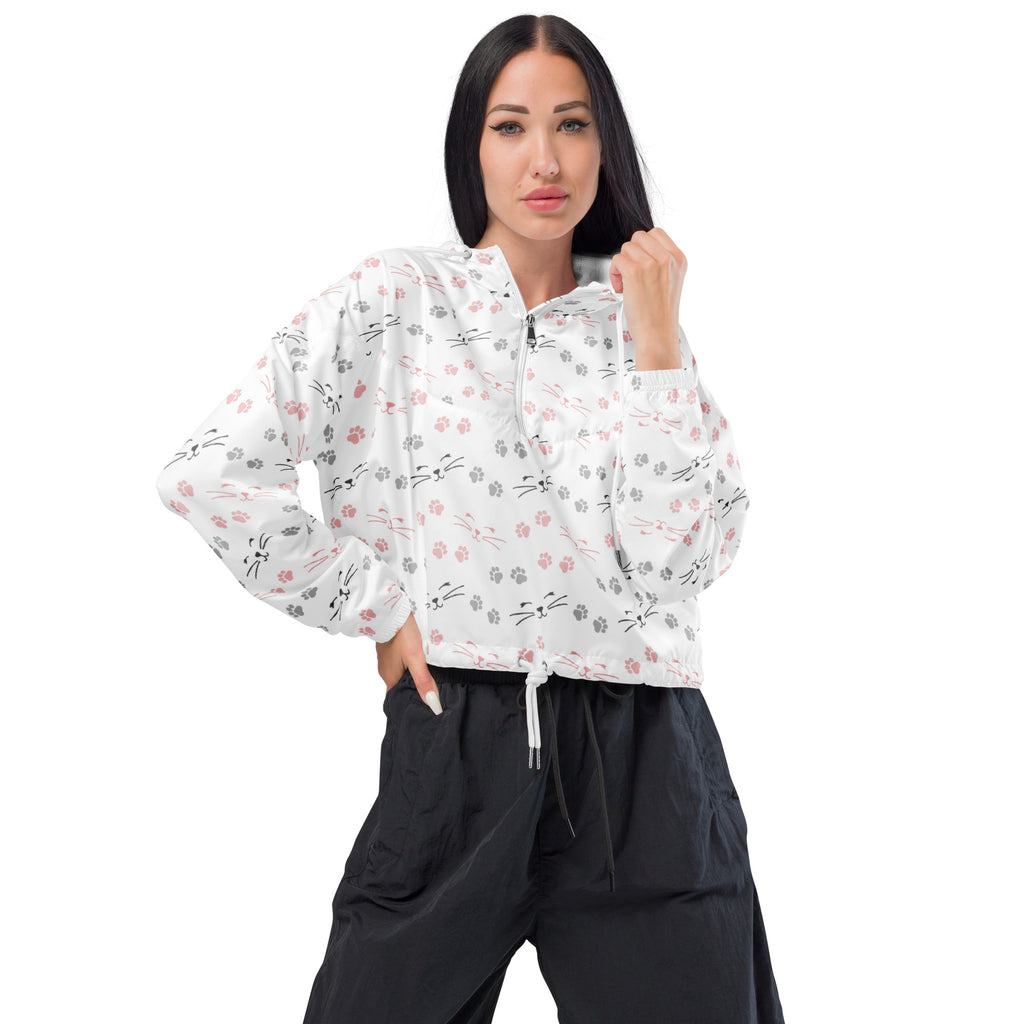 White long-sleeved cropped windbreaker with half-zip front and pink and gray cat paw and whisker print
