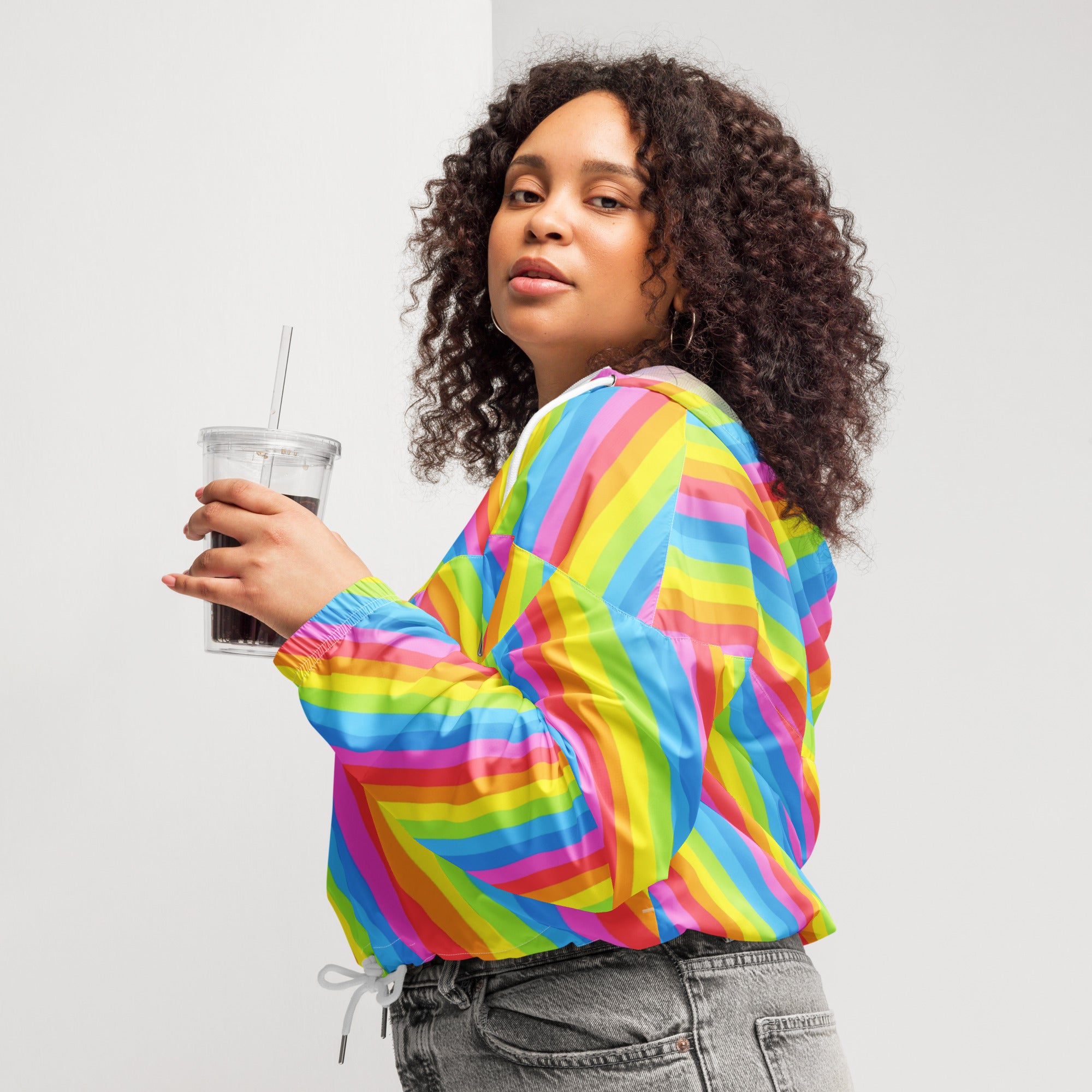 Women’s rainbow stripe cropped windbreaker in vibrant shiny lightweight fabric with elastic cuffs and adjustable hood