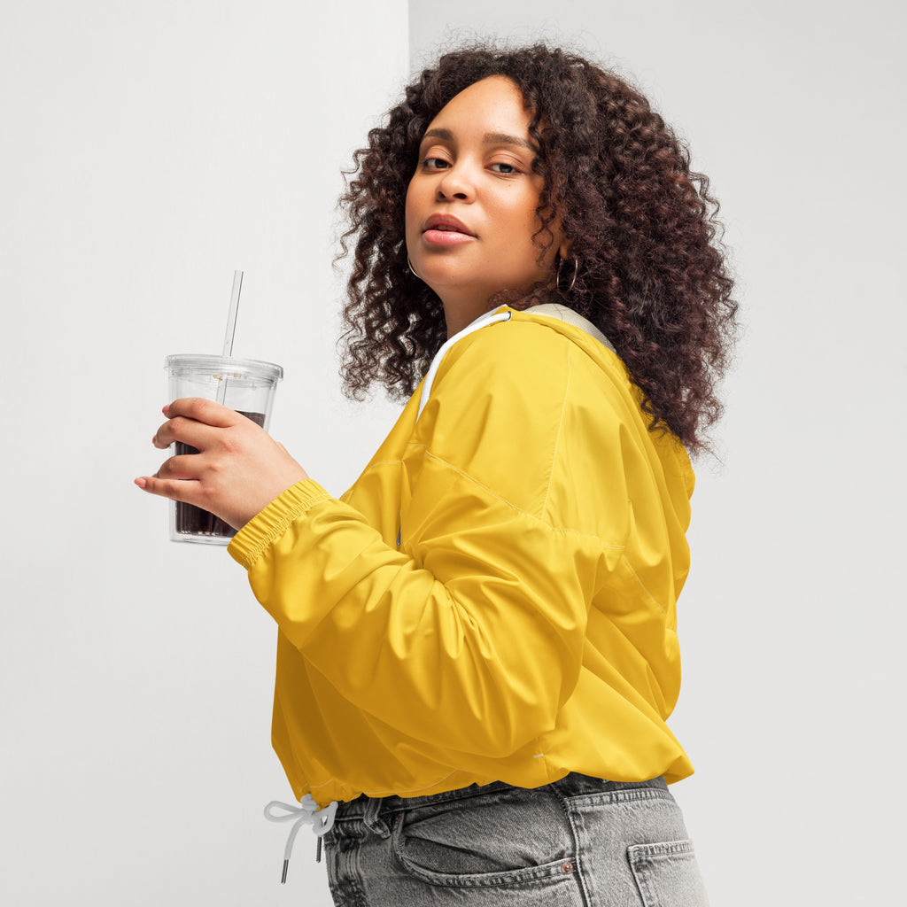 Women’s yellow cropped windbreaker with white drawstring and hood lining lightweight water resistant jacket with pockets