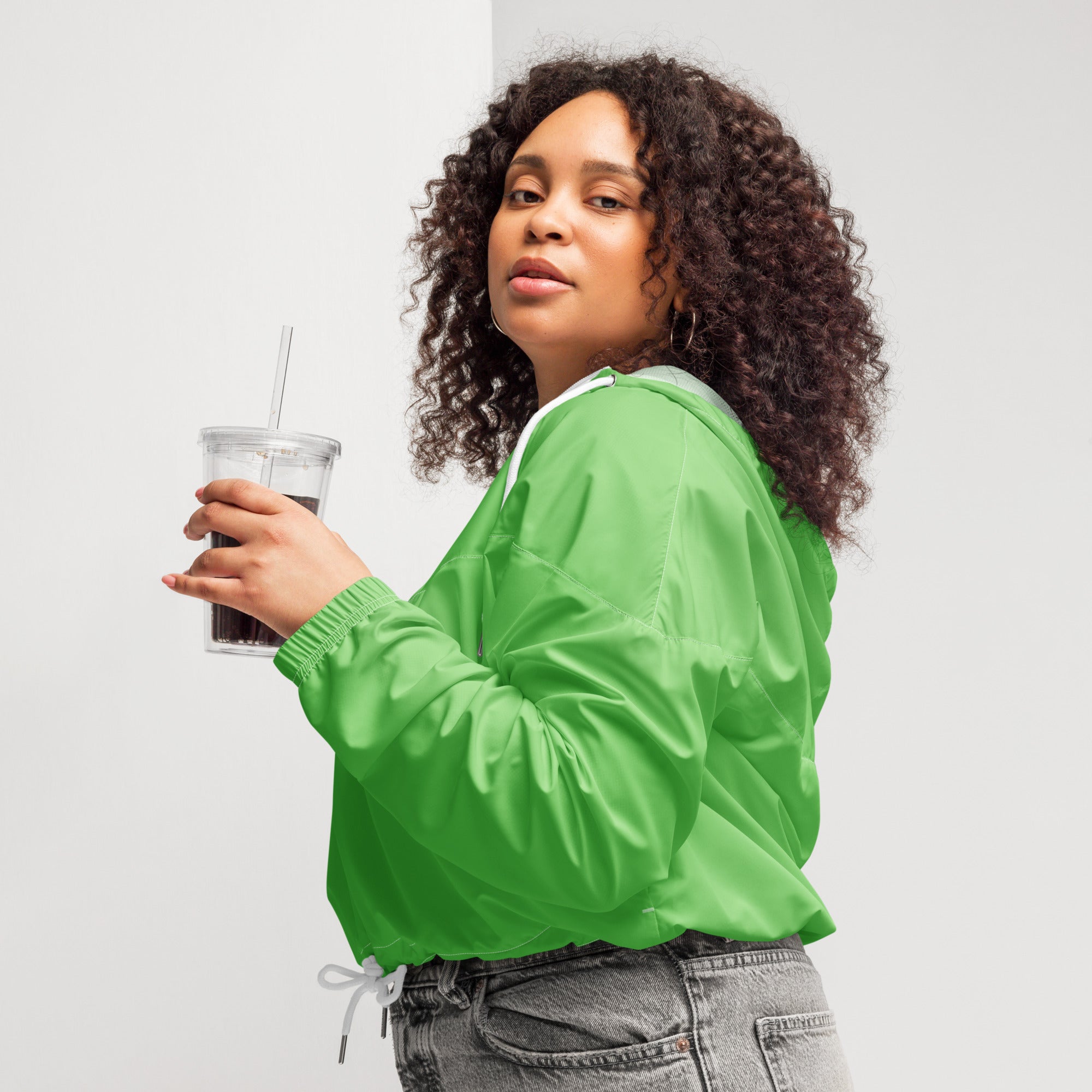 Women’s vibrant green cropped bomber jacket with white drawstring and ribbed cuffs lightweight and water resistant