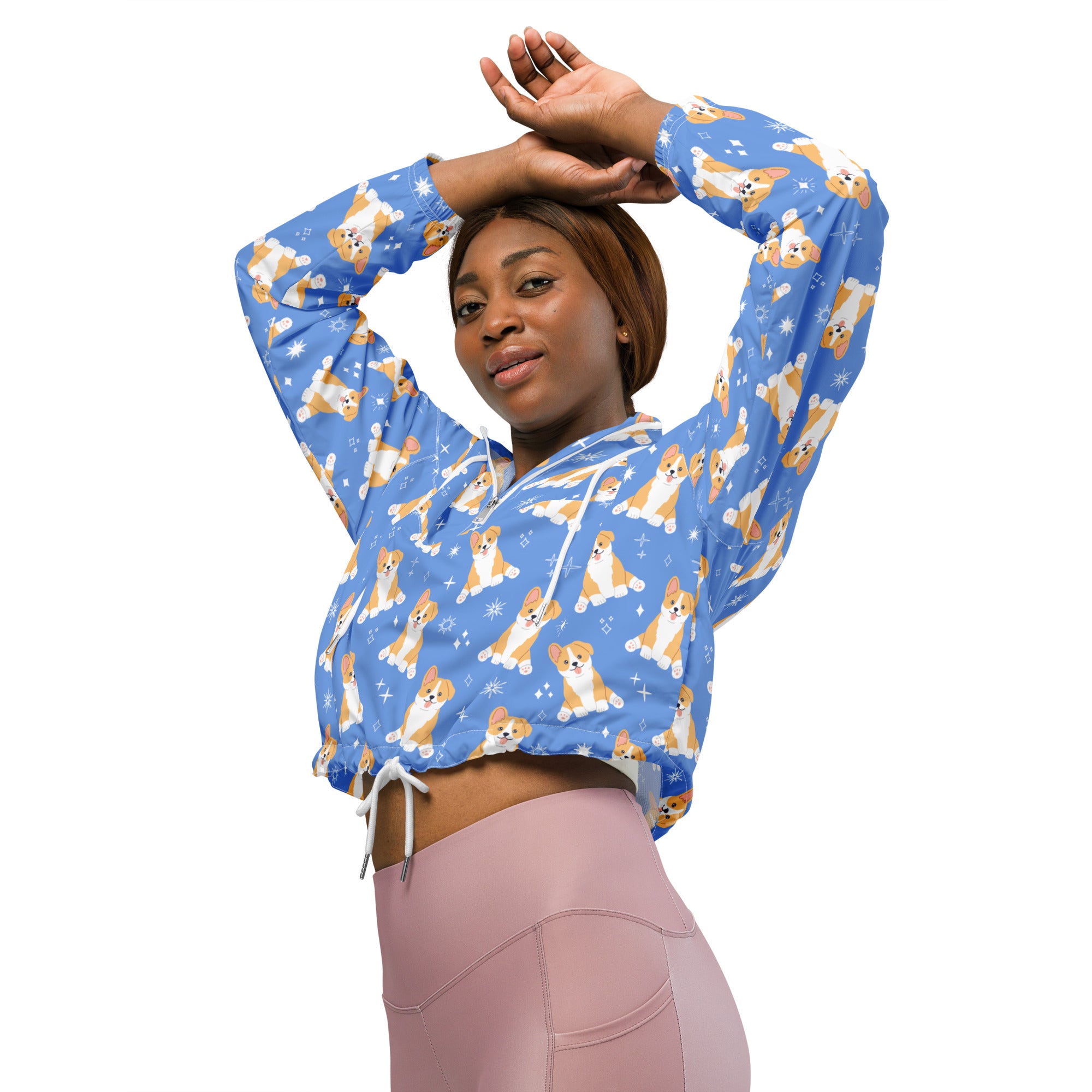 Women’s blue lightweight water resistant cropped windbreaker with adjustable hood featuring tan and white corgi pattern