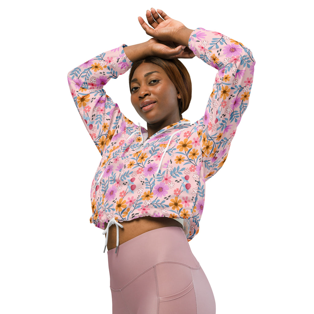 Women’s pink floral cropped windbreaker hoodie with long sleeves and adjustable drawstring hood made from lightweight fabric