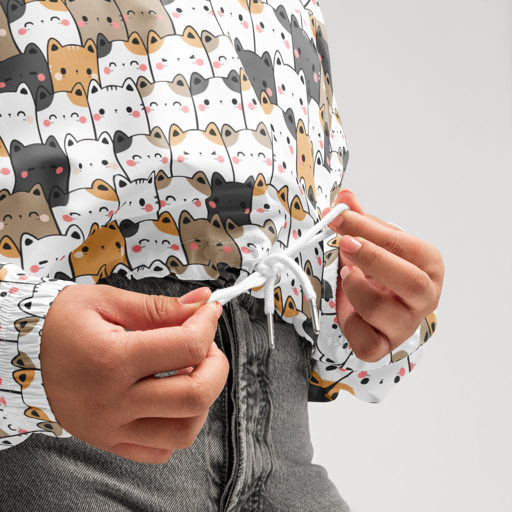 Women’s kawaii cat cropped white windbreaker featuring playful cartoon cats with adjustable hood and pockets