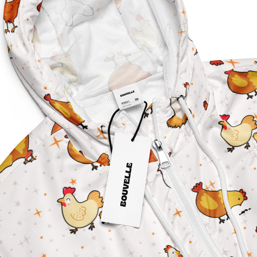 White hooded cropped windbreaker jacket with playful orange and yellow chicken pattern and star accents for women