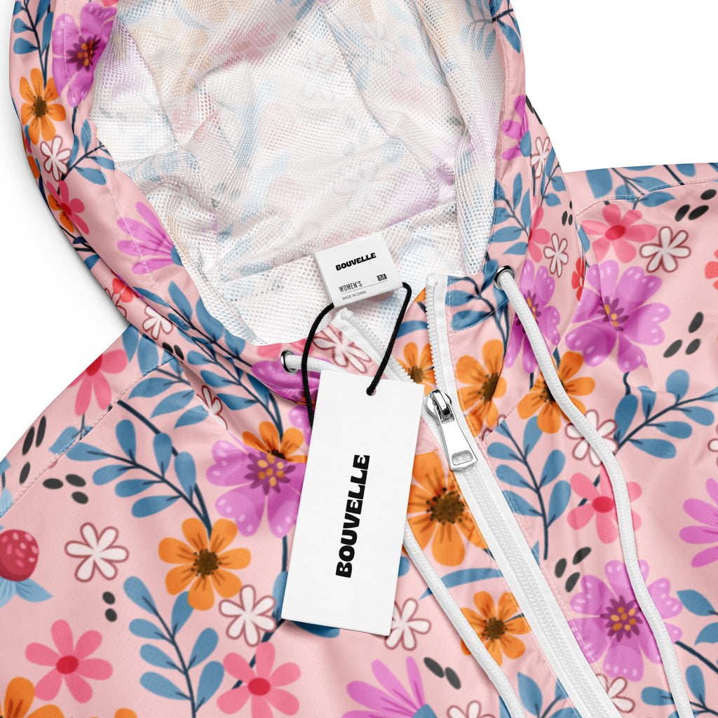 Women’s pink floral cropped windbreaker with mesh-lined hood white zipper lightweight water resistant jacket