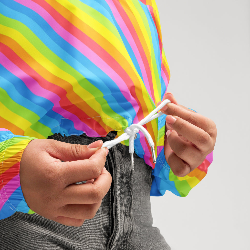 Women’s lightweight water resistant rainbow stripe cropped windbreaker with vibrant diagonal stripes and adjustable hood