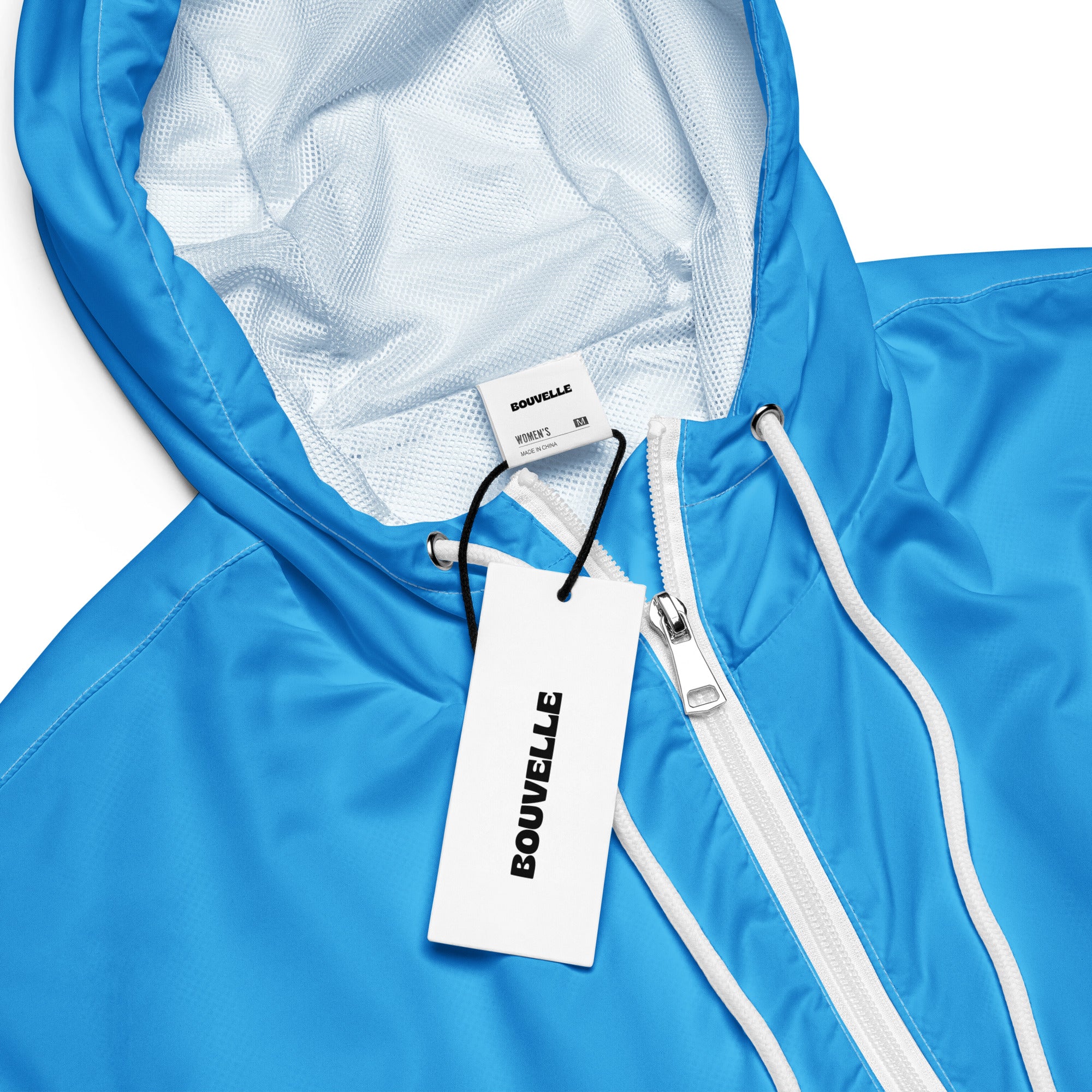 Women’s sky blue bouvelle hooded windbreaker with white zipper and mesh lining lightweight water resistant jacket