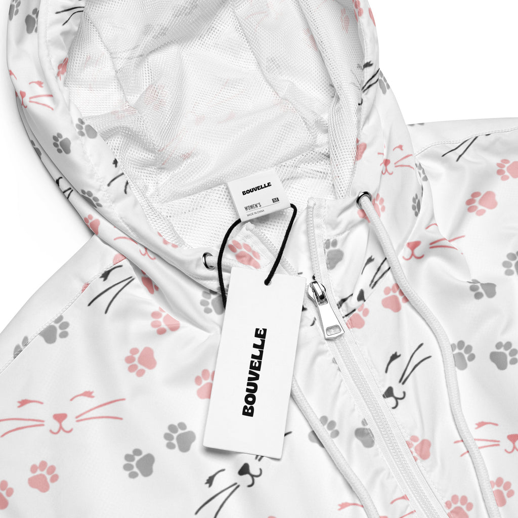 White bouvelle women’s lightweight windbreaker jacket with pink and gray cat faces and paw prints pattern