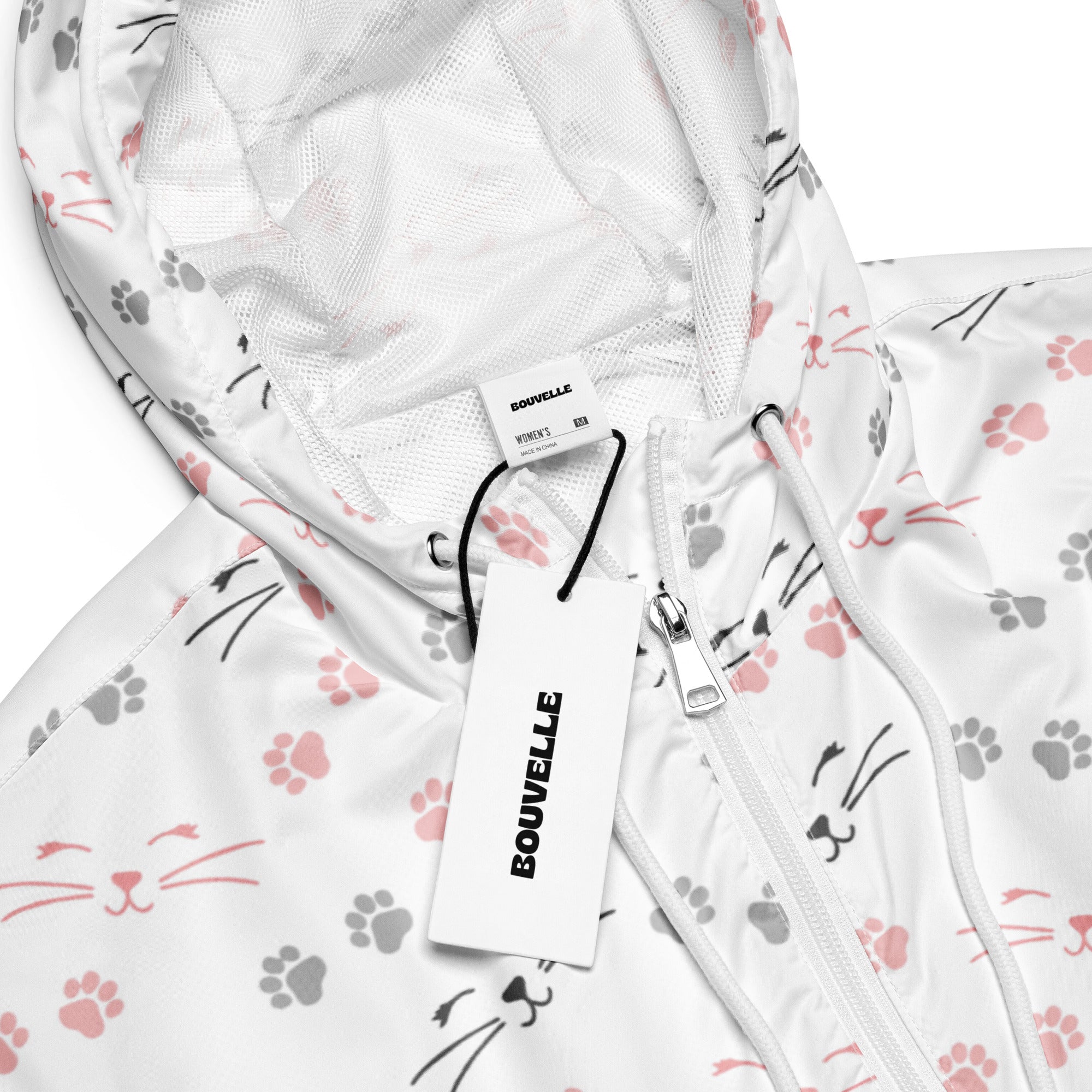 White bouvelle women’s lightweight windbreaker jacket with pink and gray cat faces and paw prints pattern