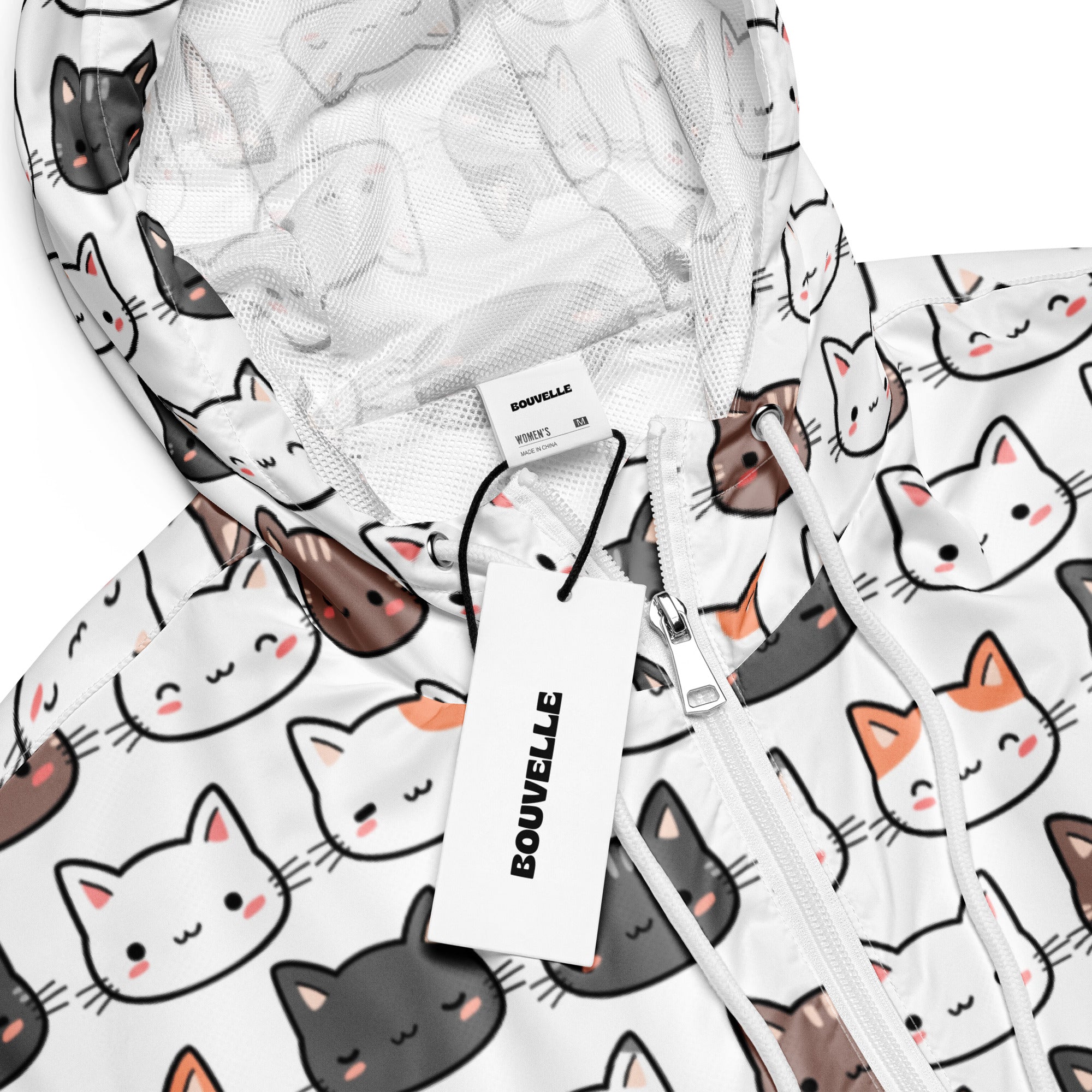 White hooded cropped windbreaker with playful black gray and orange cartoon cats and pink cheeks, lightweight and water resistant